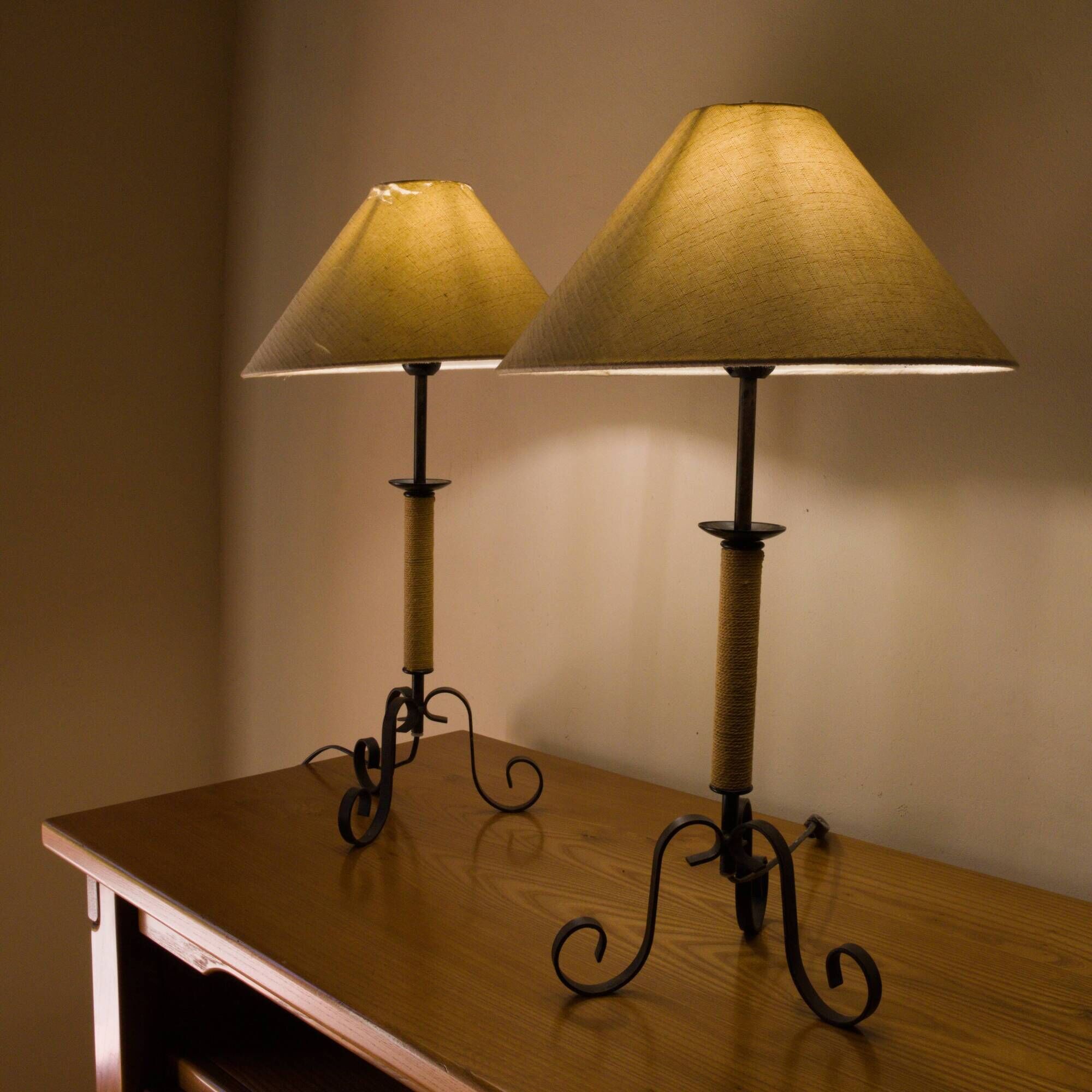Pair of wrought iron and rope table lamps, adjustable lampshade.