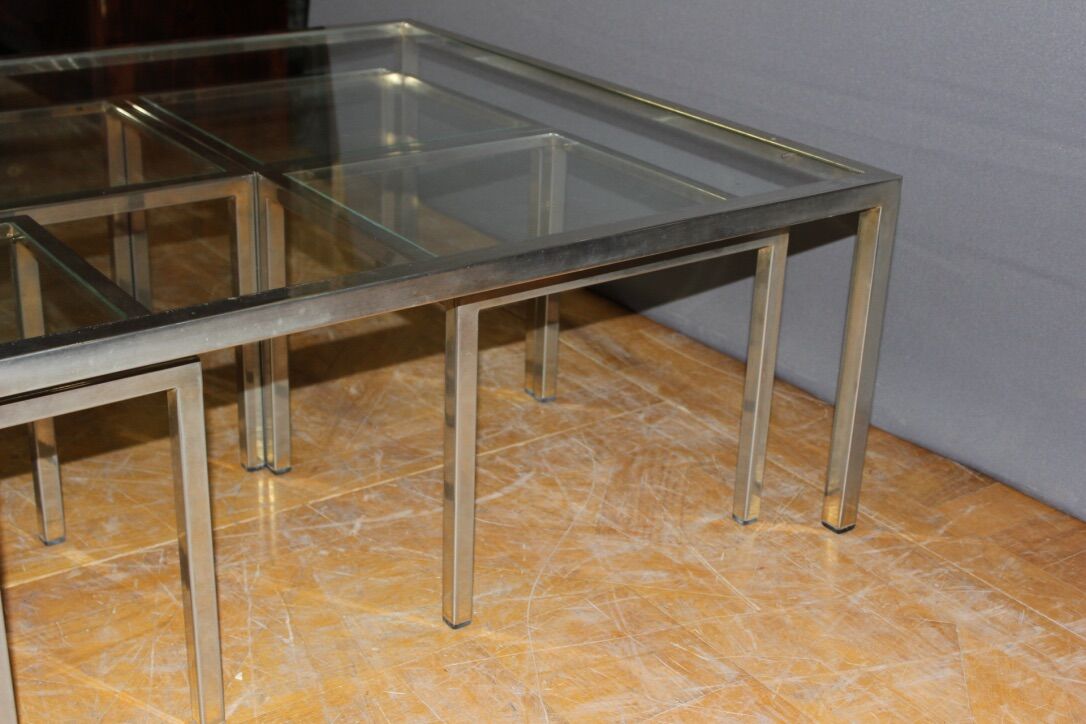 Coffee table and its steel and glass wiggles around 1970