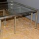 Coffee table and its steel and glass wiggles around 1970
