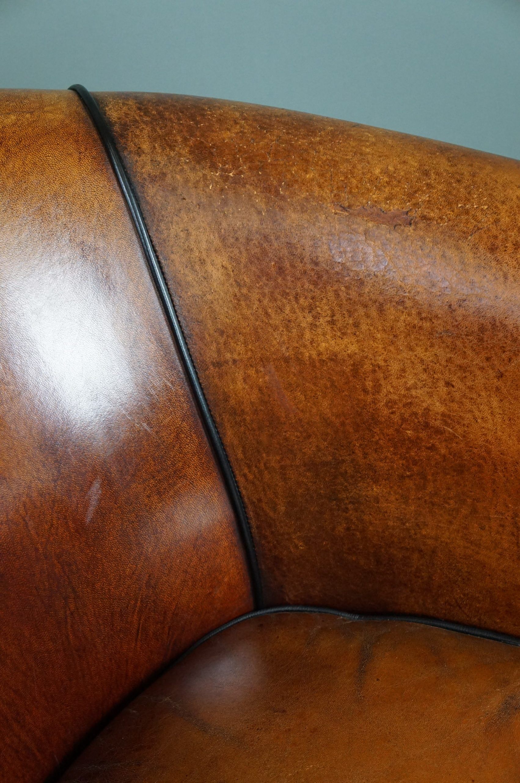 Set of 2 club chairs in black piping sheep leather