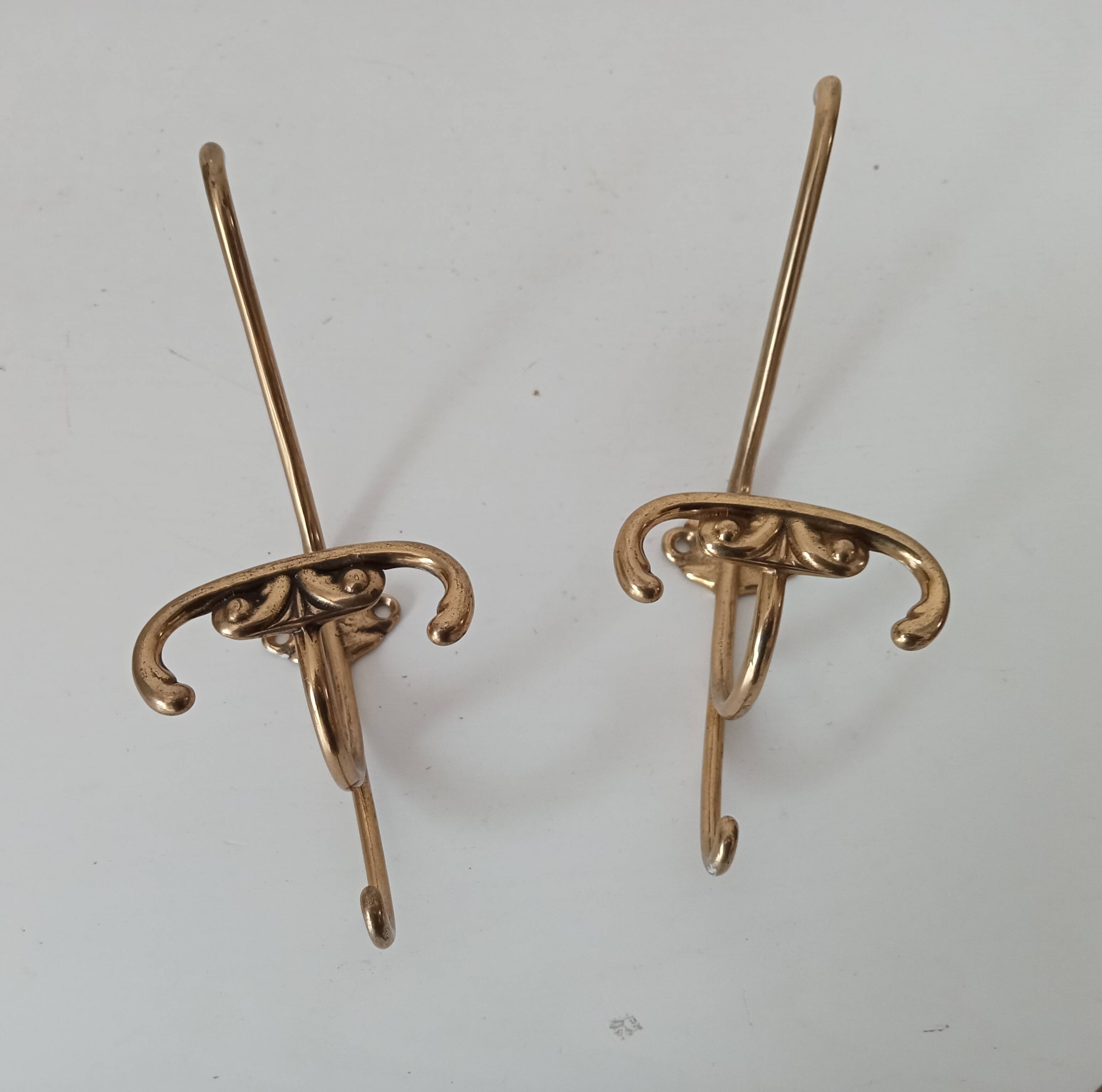 Old coat hook in solid golden brass