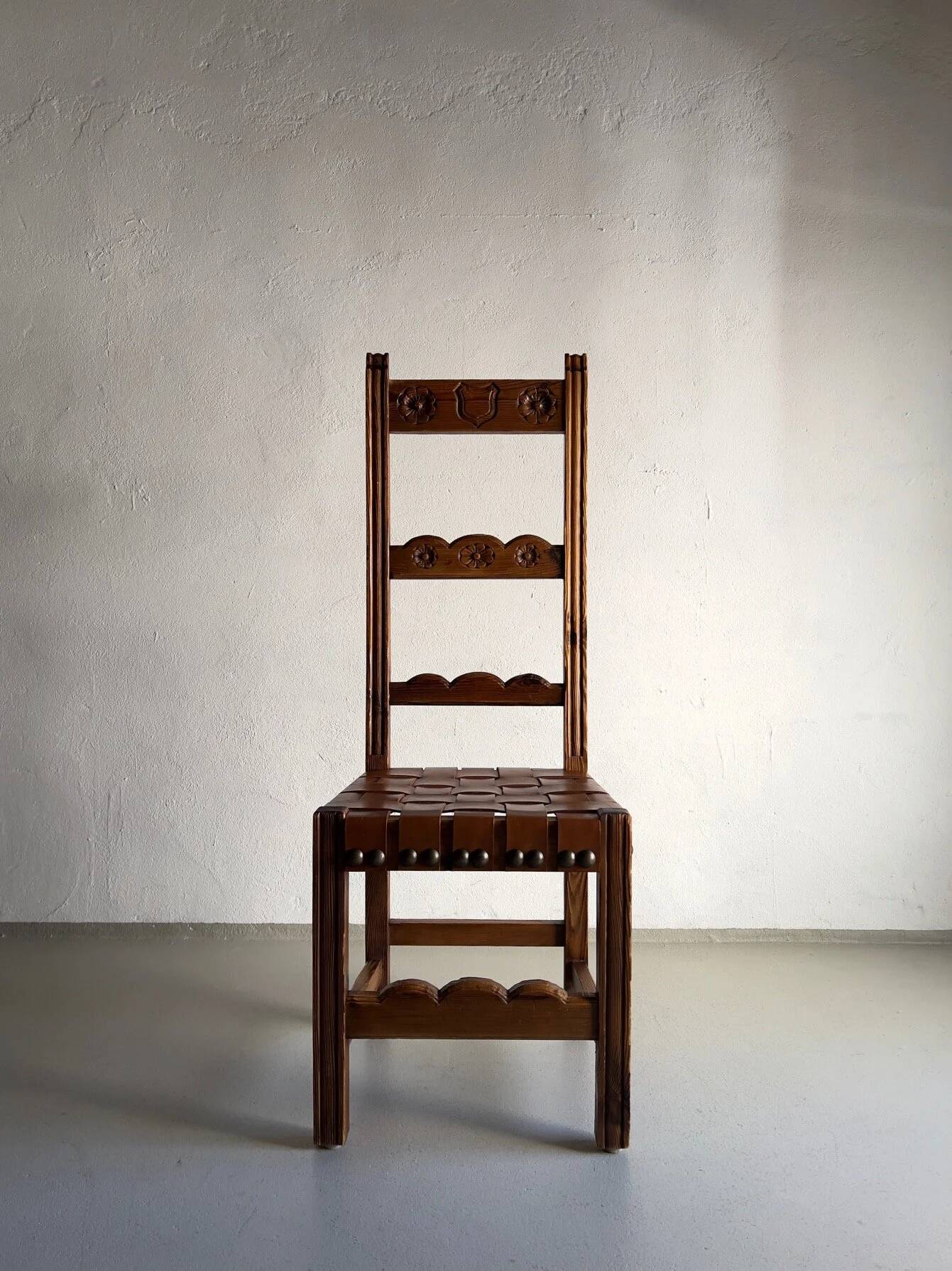 2 brutalist carved wood dining chairs with leather seat | The Netherlands | 1970s