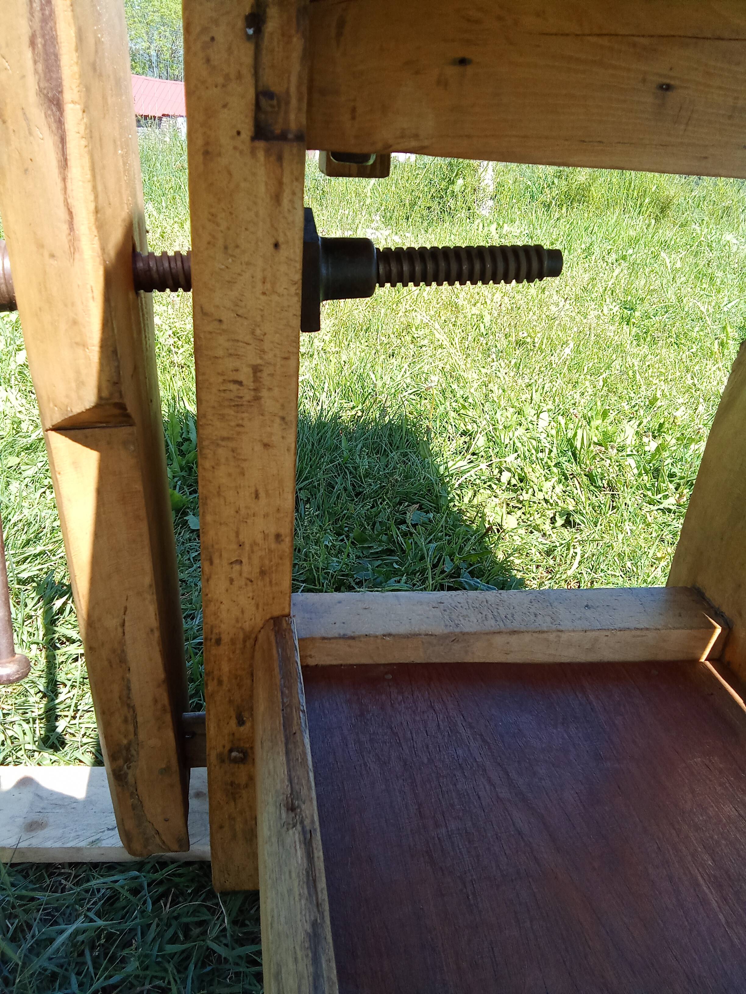 Old solid wood carpenter's bench with 2 functional vices.