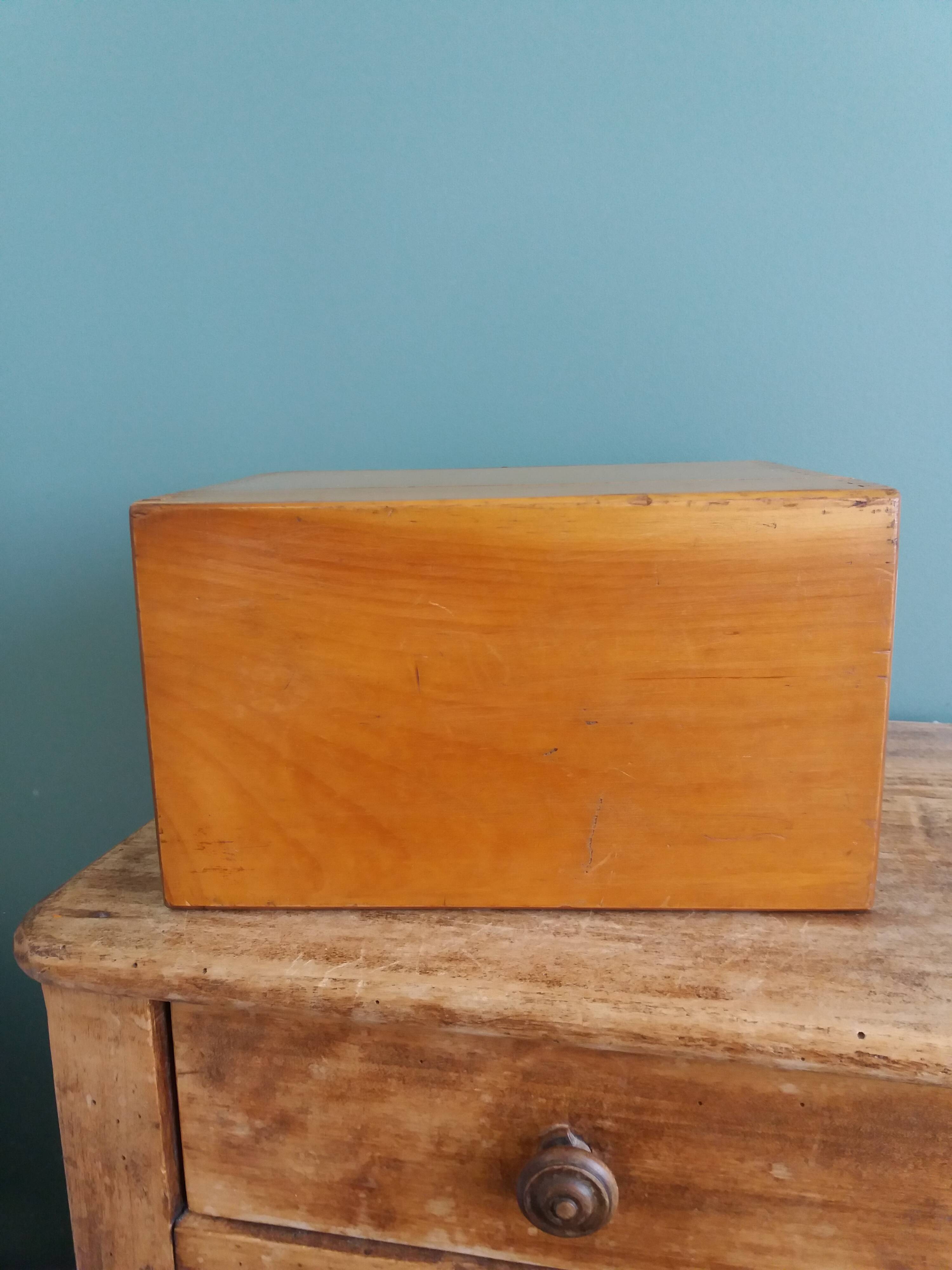 Wooden storage box, empty pocket