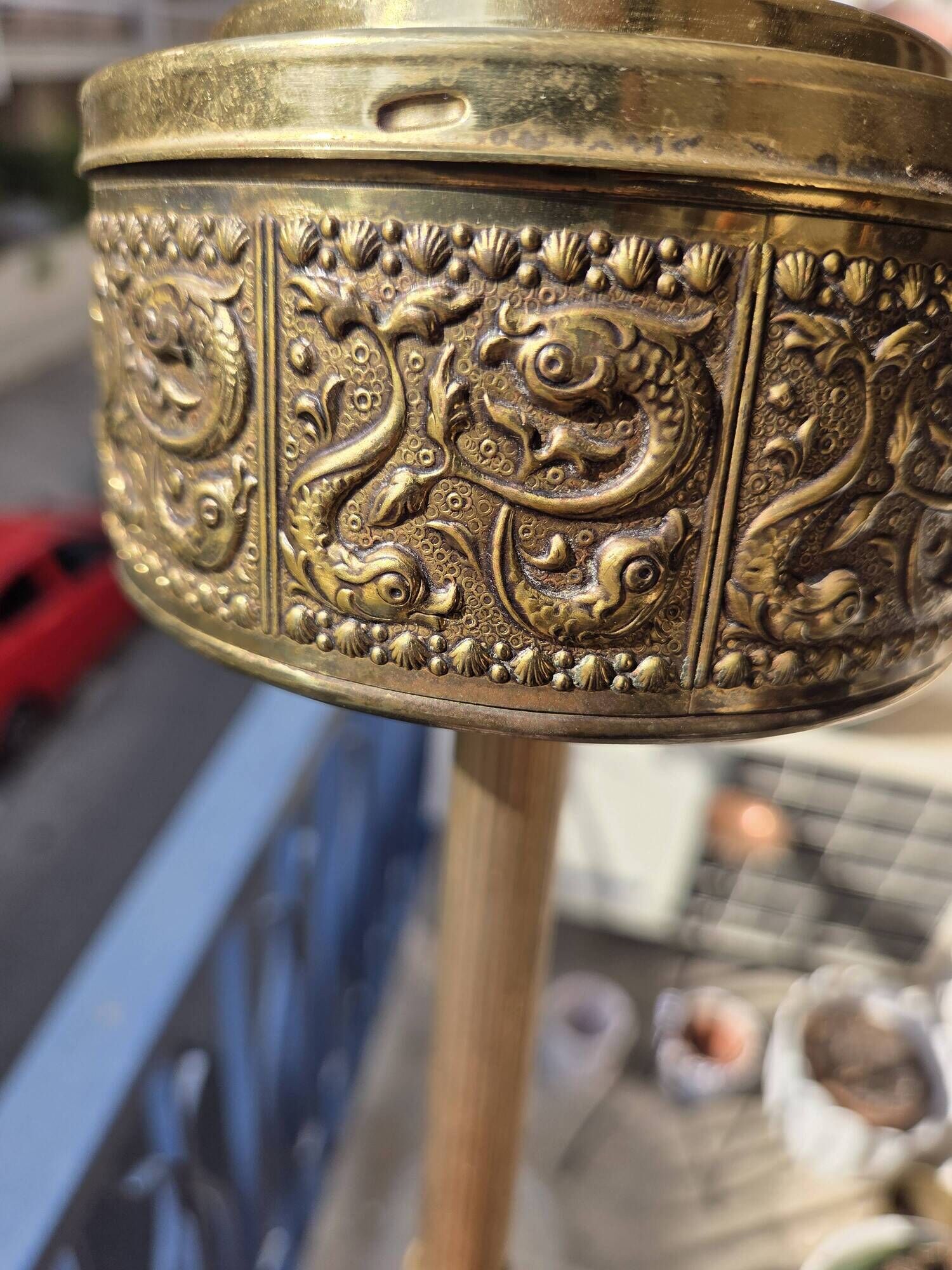 Floor ashtray in gilded brass (frieze of fish)