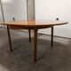 Scandinavian table in round teak with built-in extensions 1960