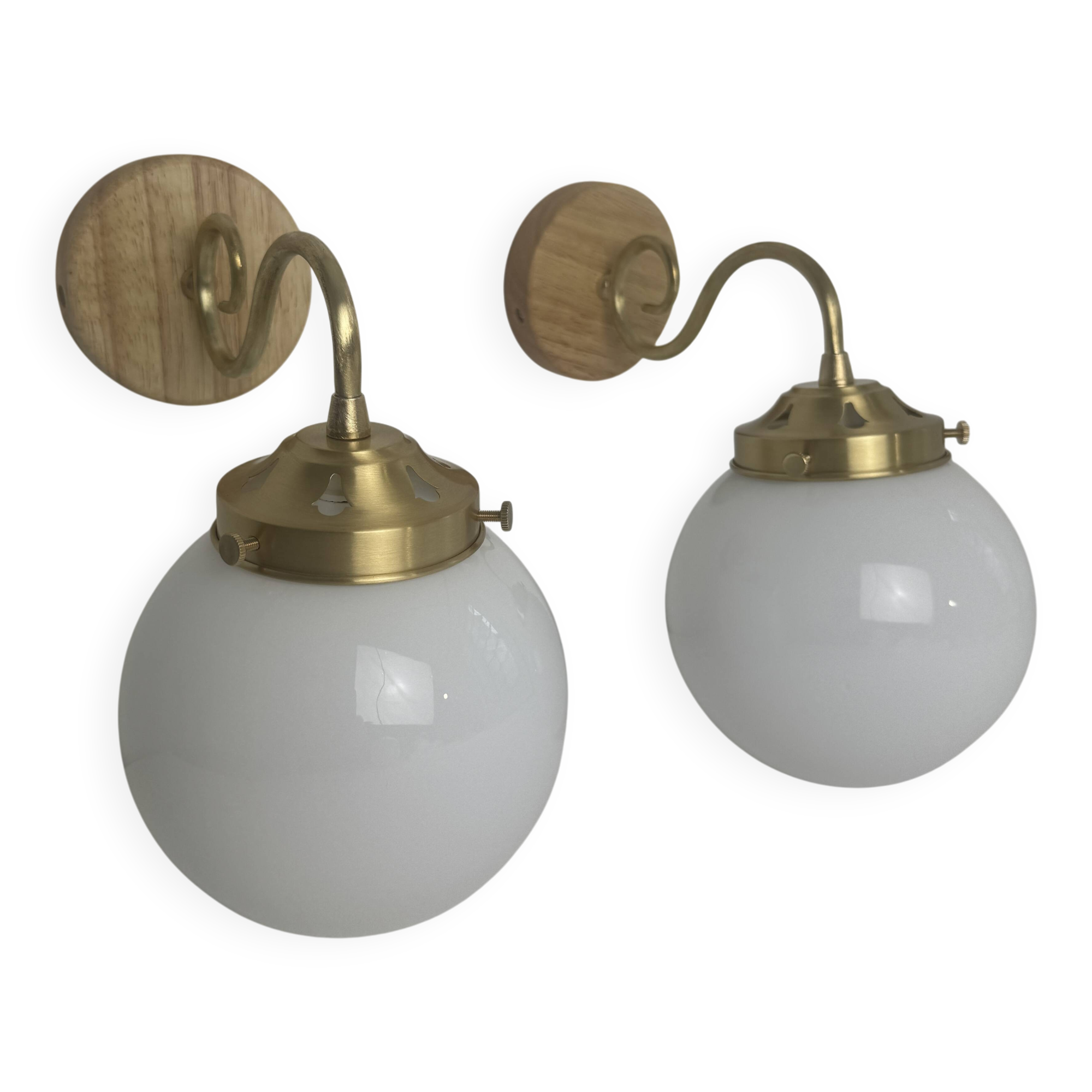 A pair of vintage opaline and brass wall lights