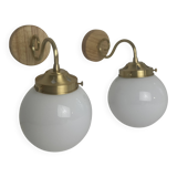 A pair of vintage opaline and brass wall lights