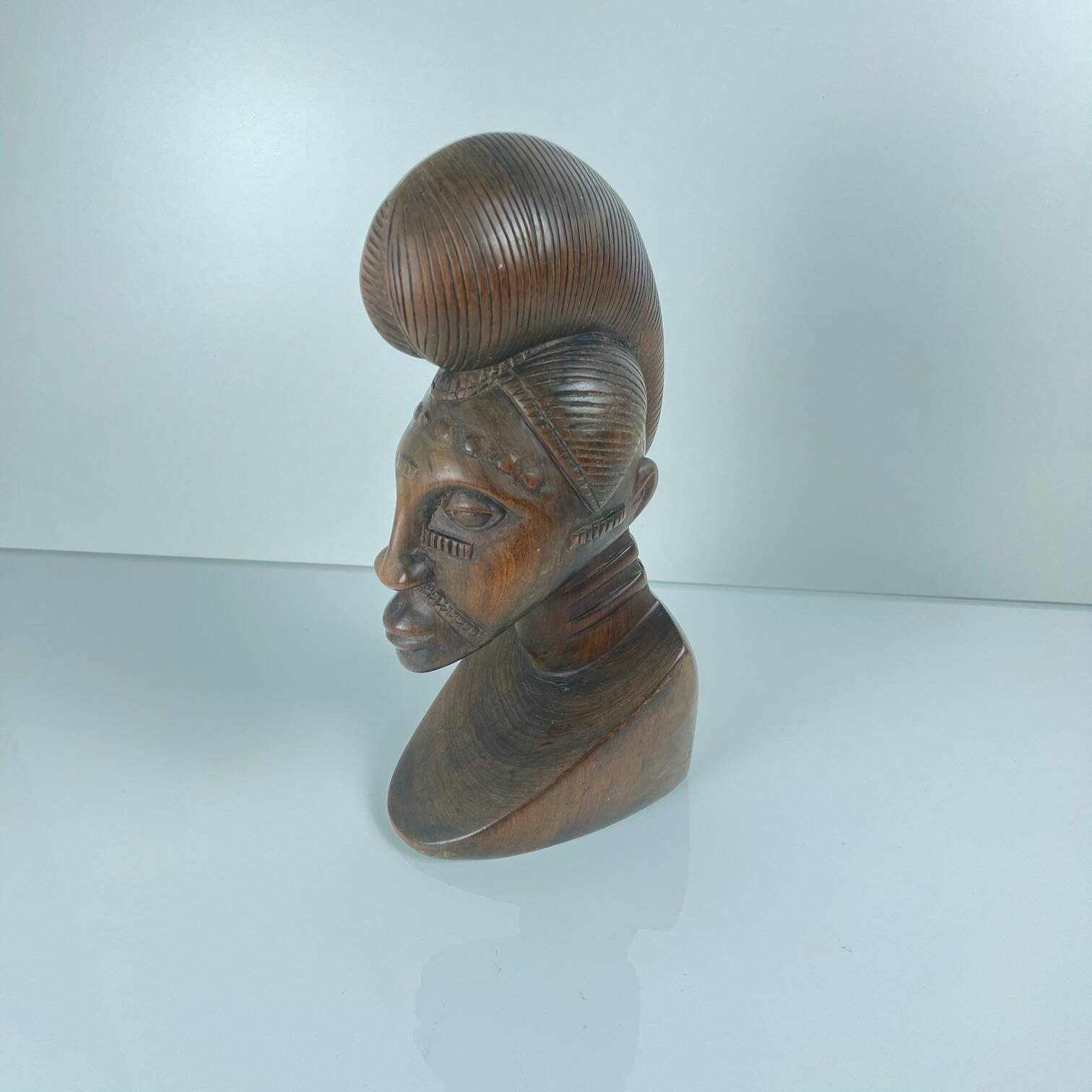 Hand-carved female bust in black wood, Baoulé style, 1960/90