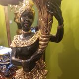 Paire de nubiens porte torchère en bois doré baroque