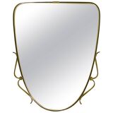 Elegant wall mirror in brass and black from the mid-century, Italy, 1950s.