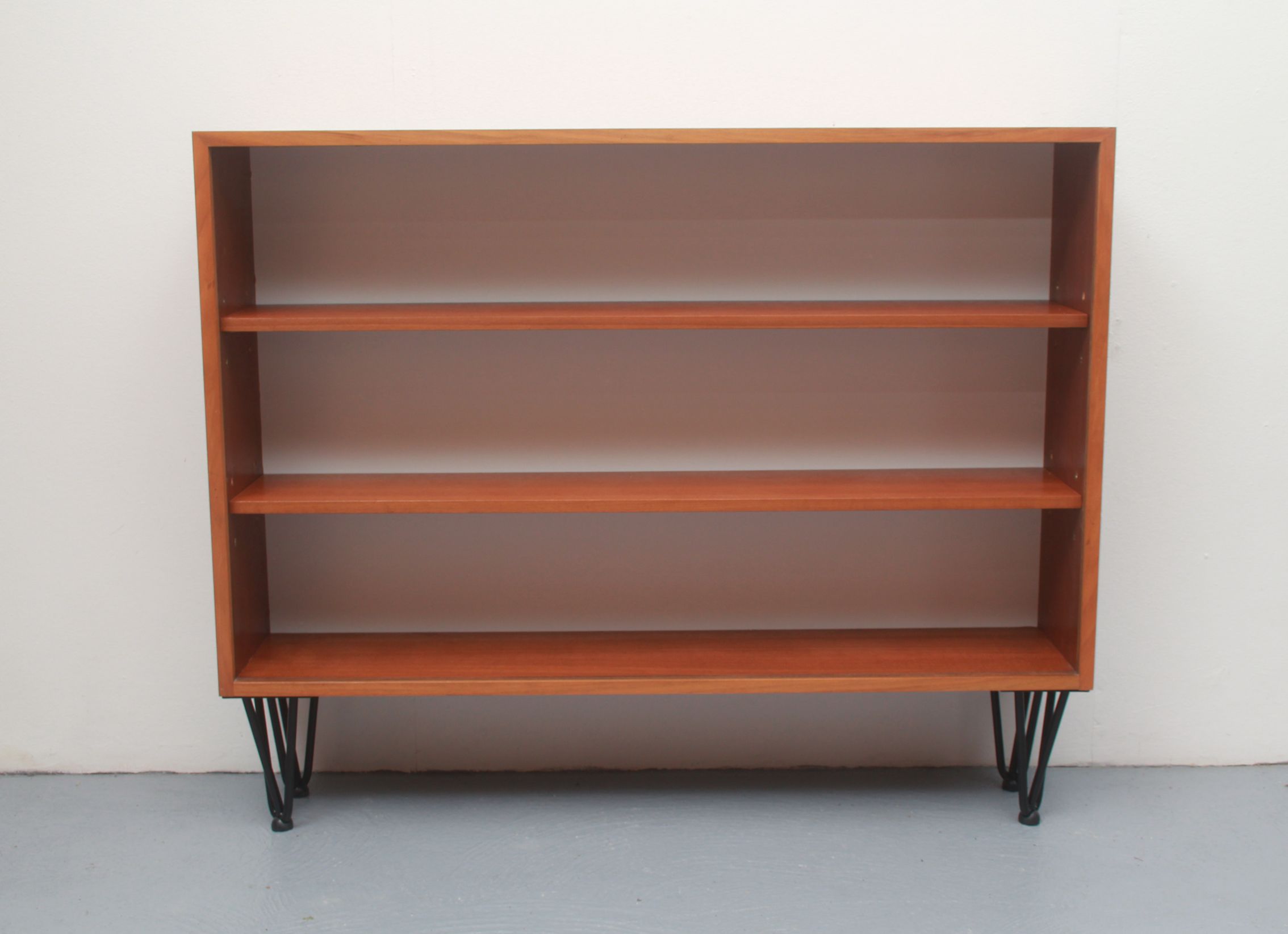 1960s book shelf in walnut, white back panel