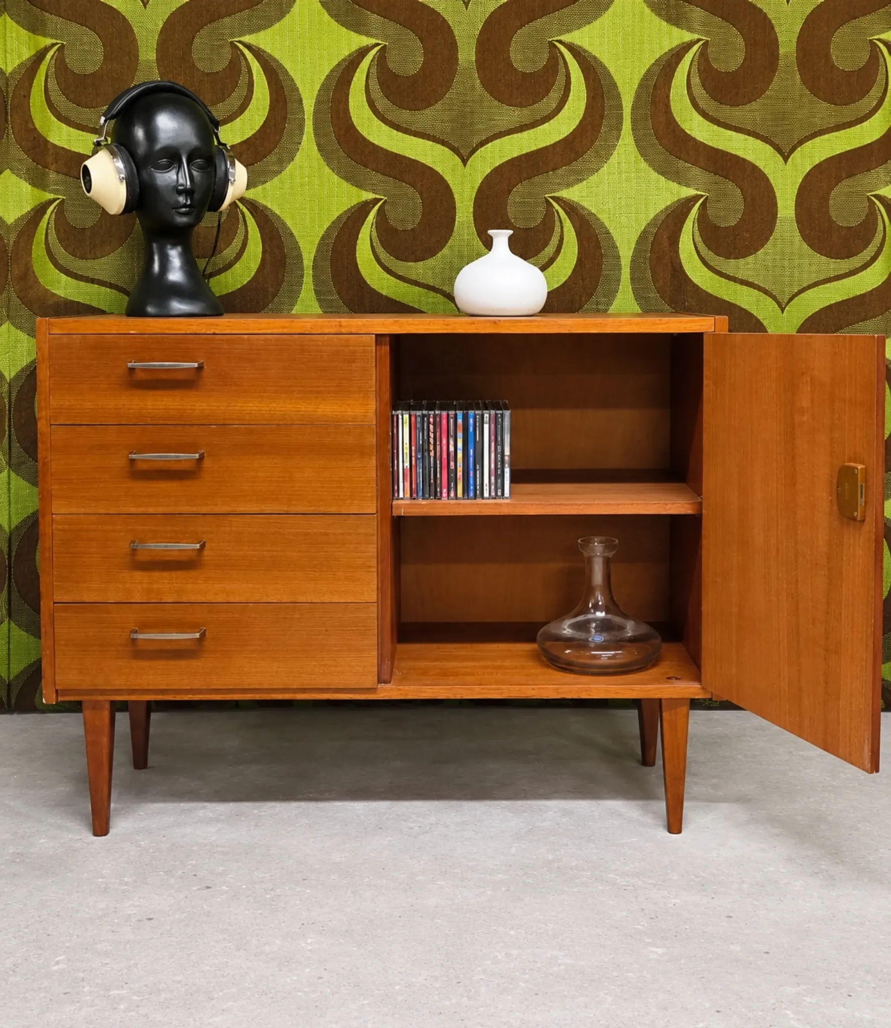 Small vintage sideboard from the 1960s with 4 drawers and a door.