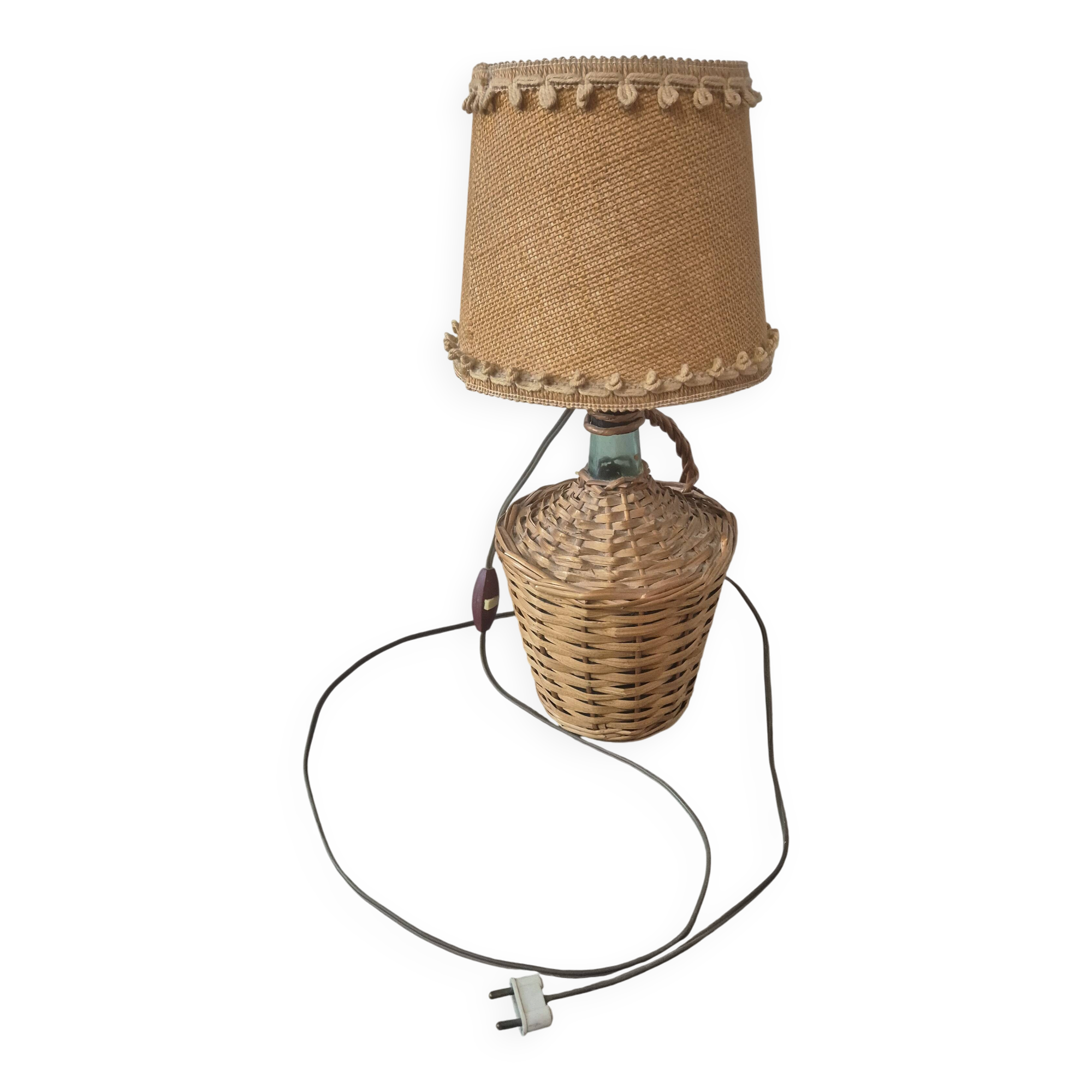 vintage table lamp dame jeanne covered in rattan wicker with a handle