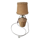 vintage table lamp dame jeanne covered in rattan wicker with a handle