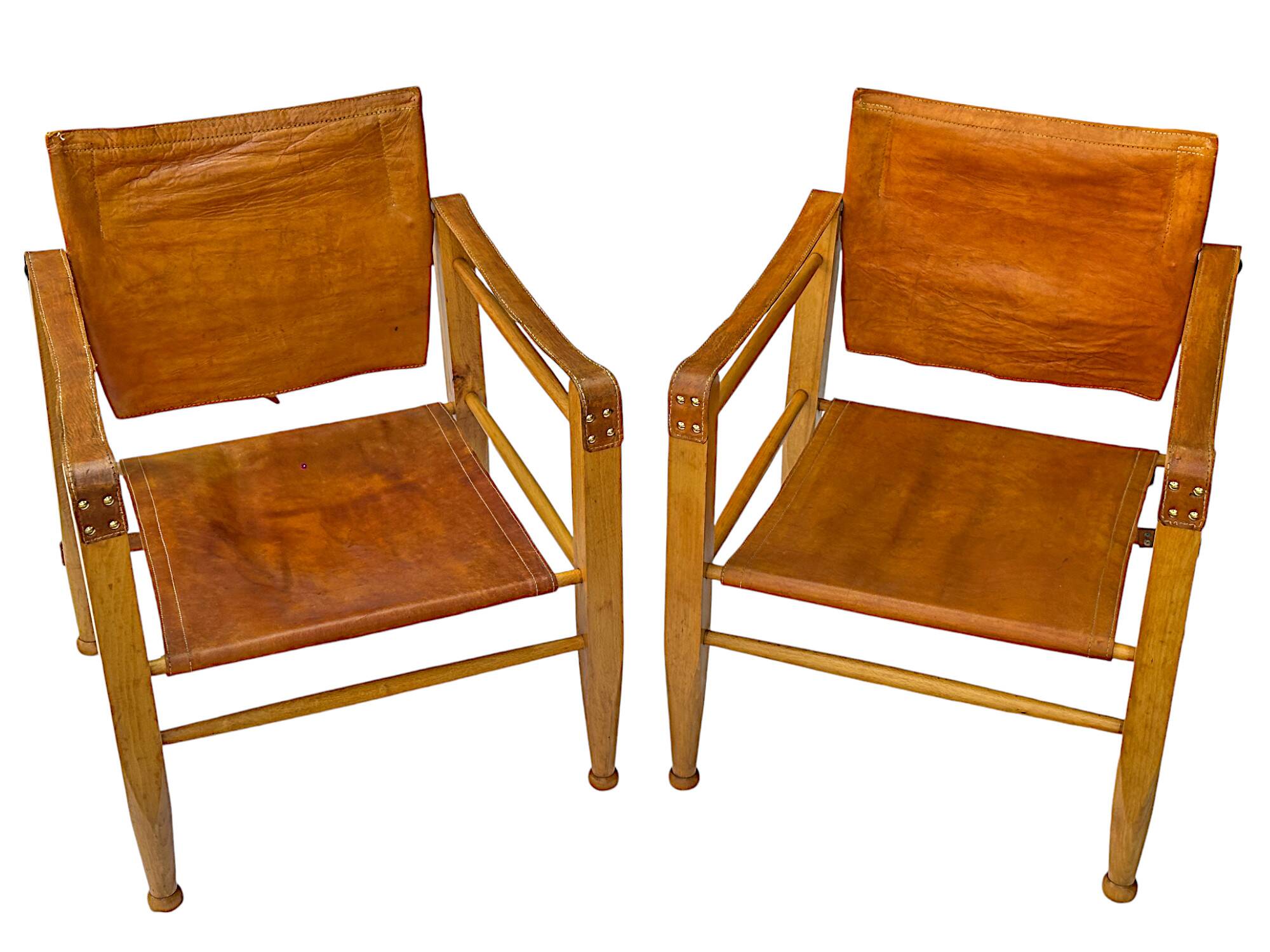 A pair of Danish beechwood and leather Safari armchairs - 1960