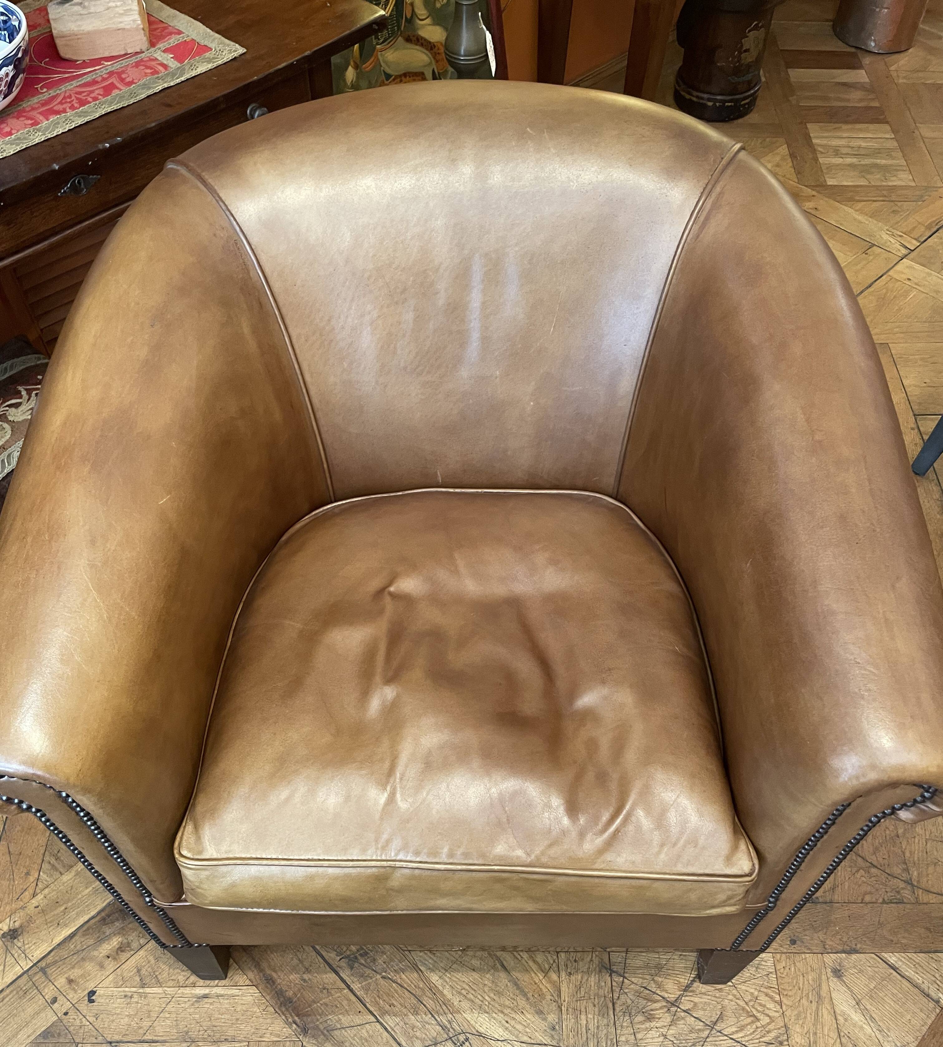pair of camel leather club armchairs