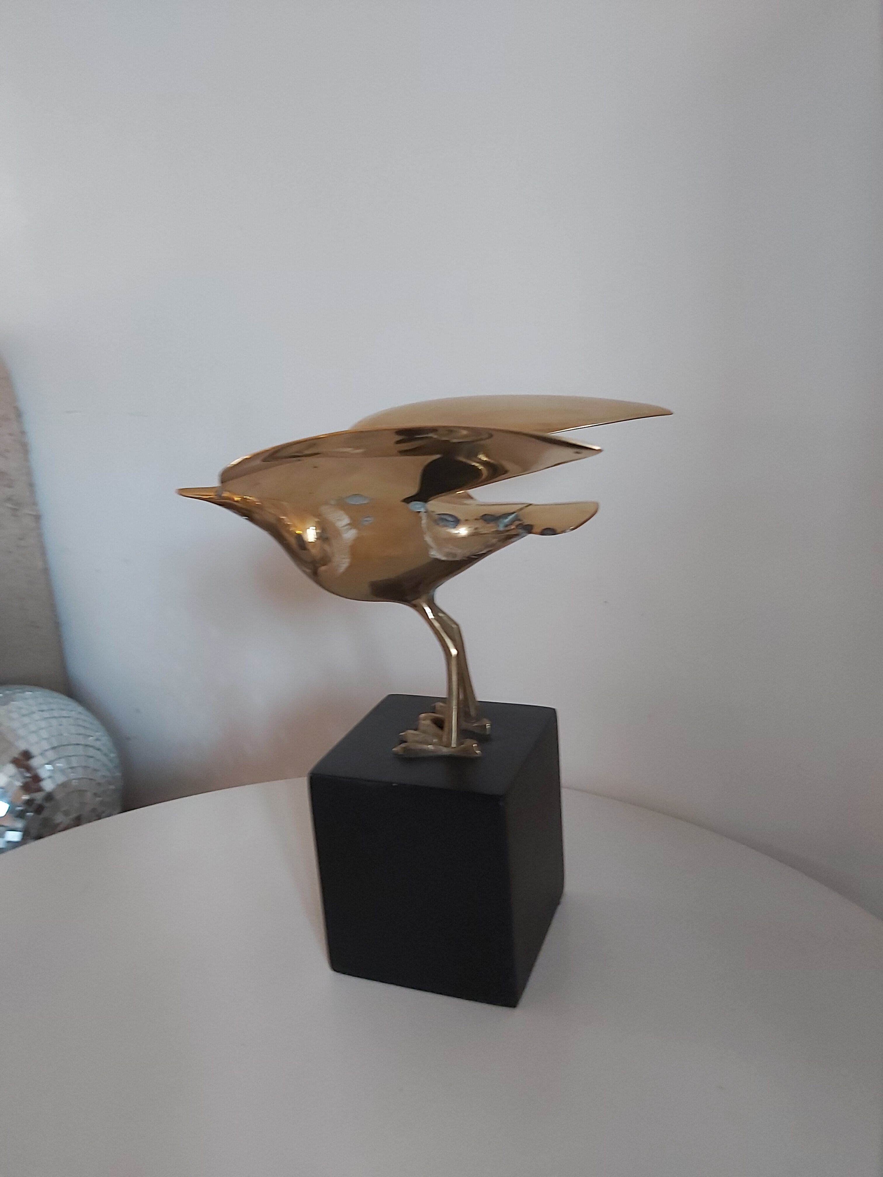 Vintage brass bird on pedestal