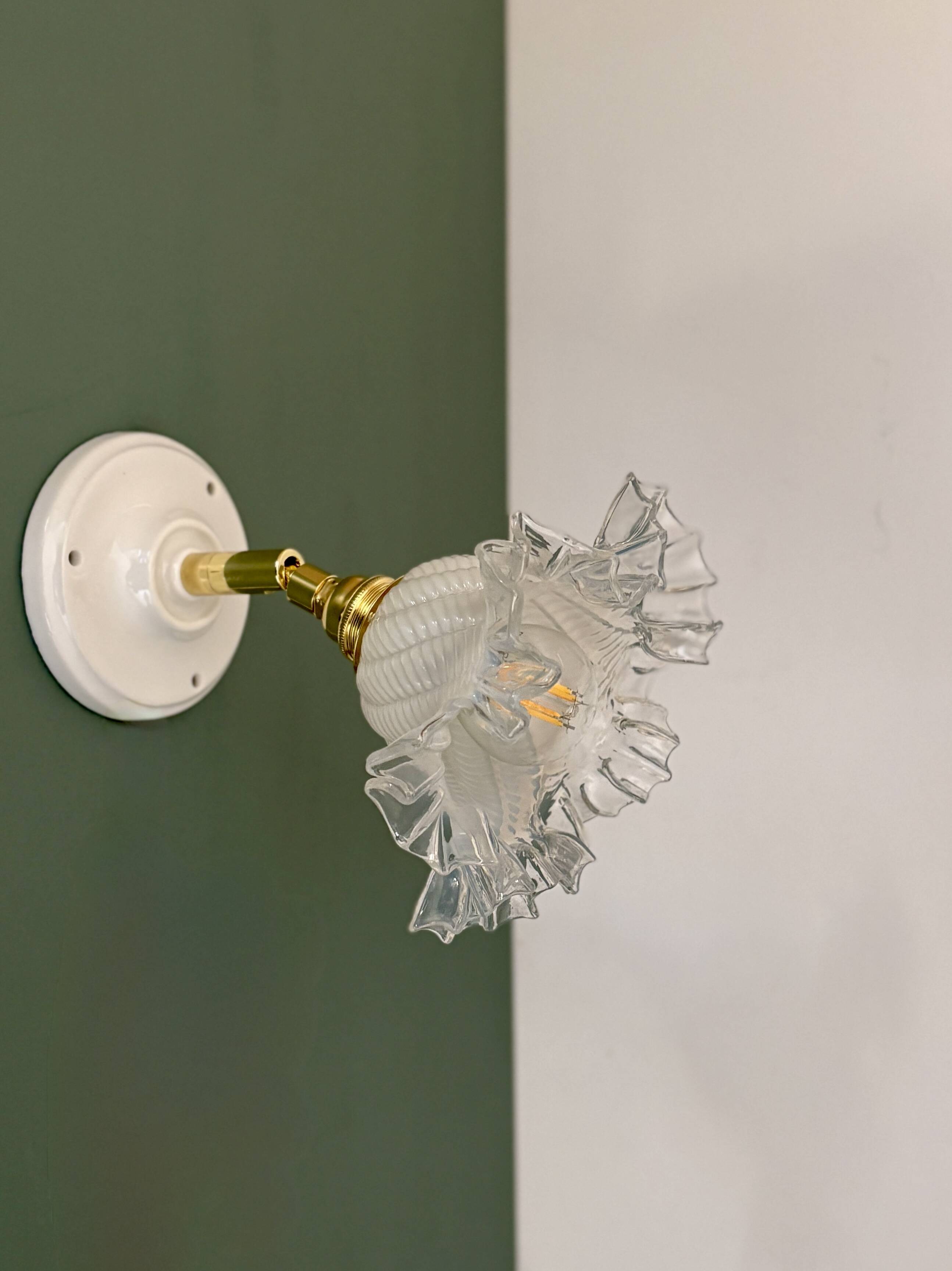Vintage tulip glass wall light in transparent, slightly pearlescent white.