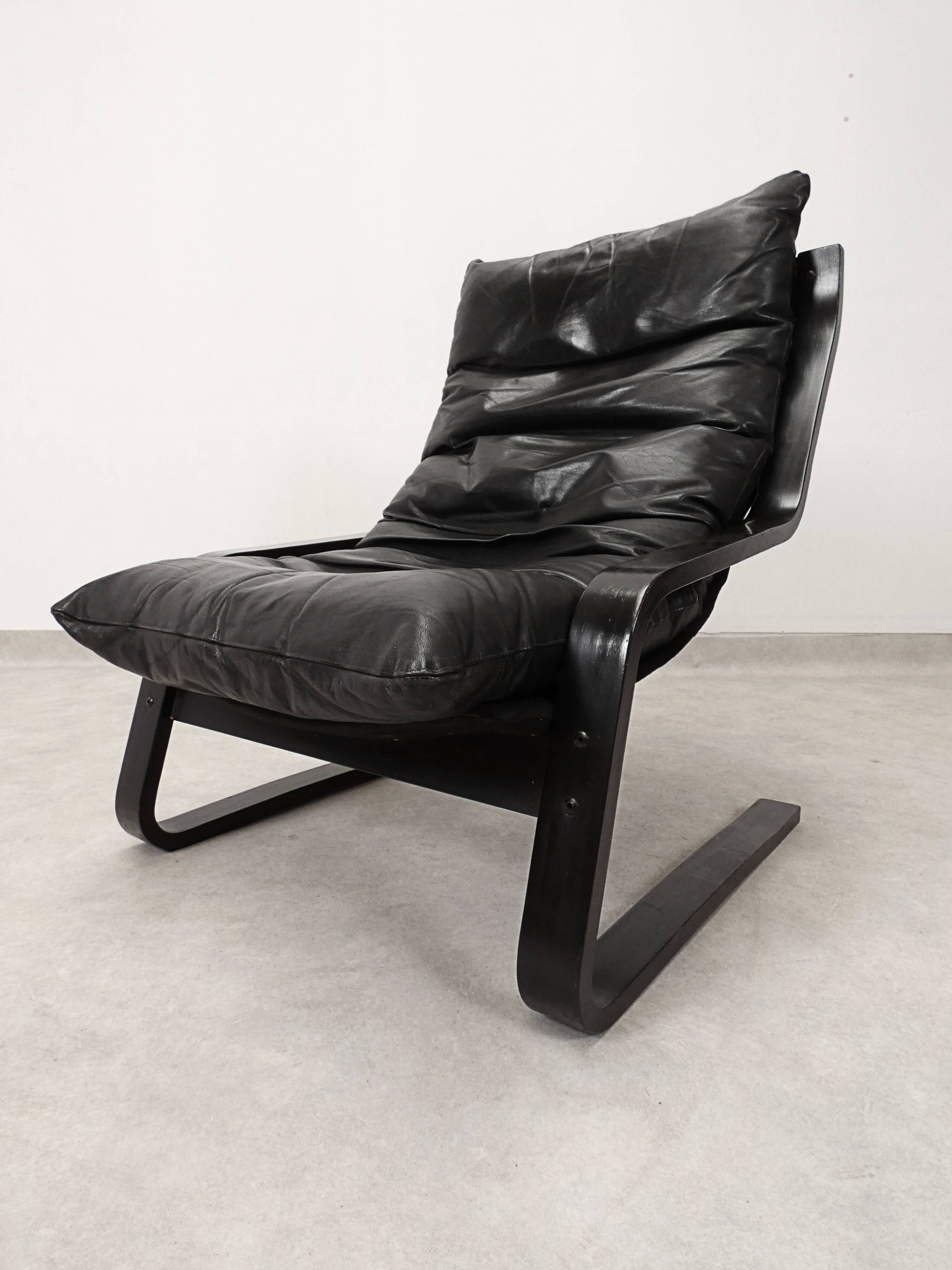 high-back scandianavian lounge chair in leather