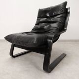 high-back scandianavian lounge chair in leather