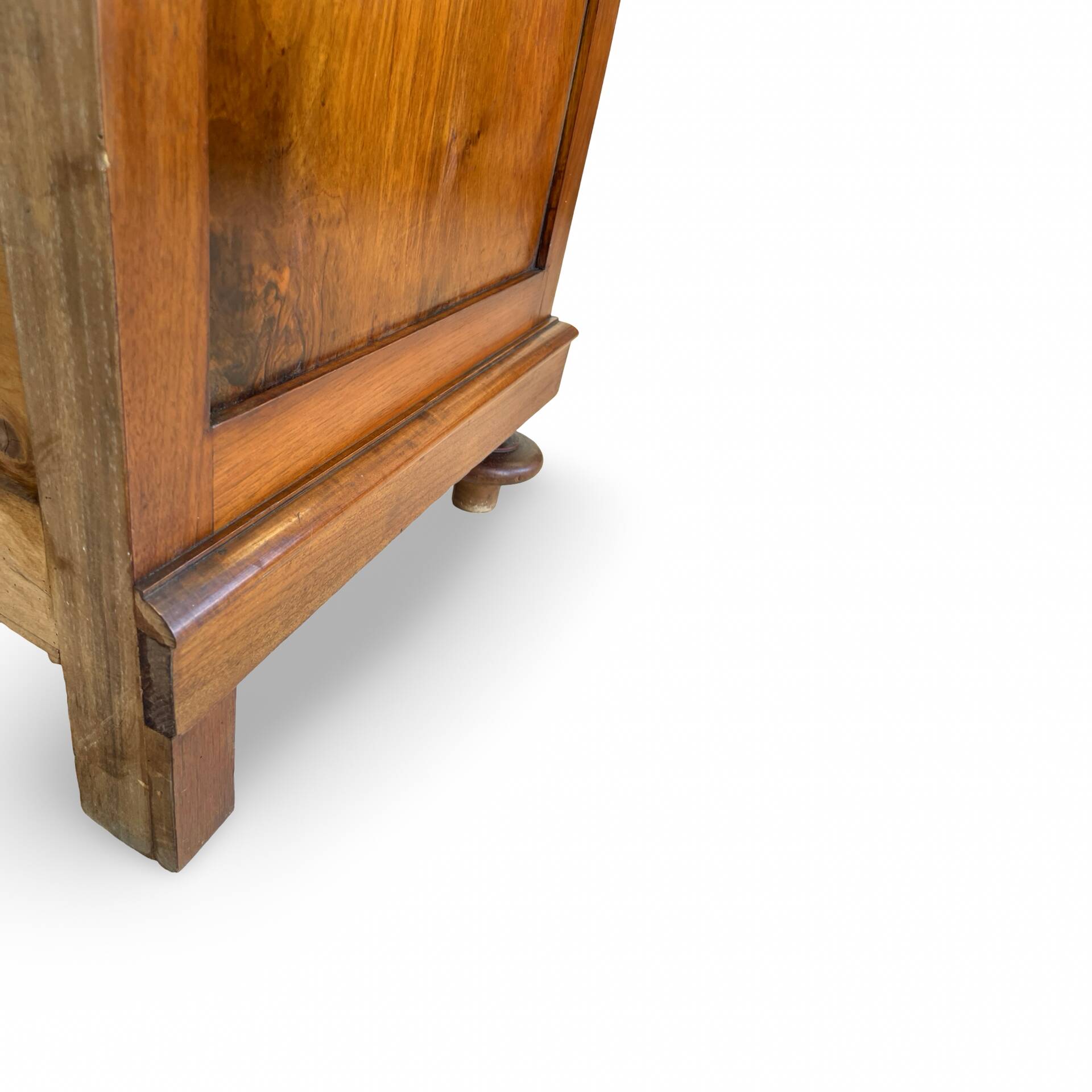 Antique walnut commode with bronze handles in the shape of a lion's mask,