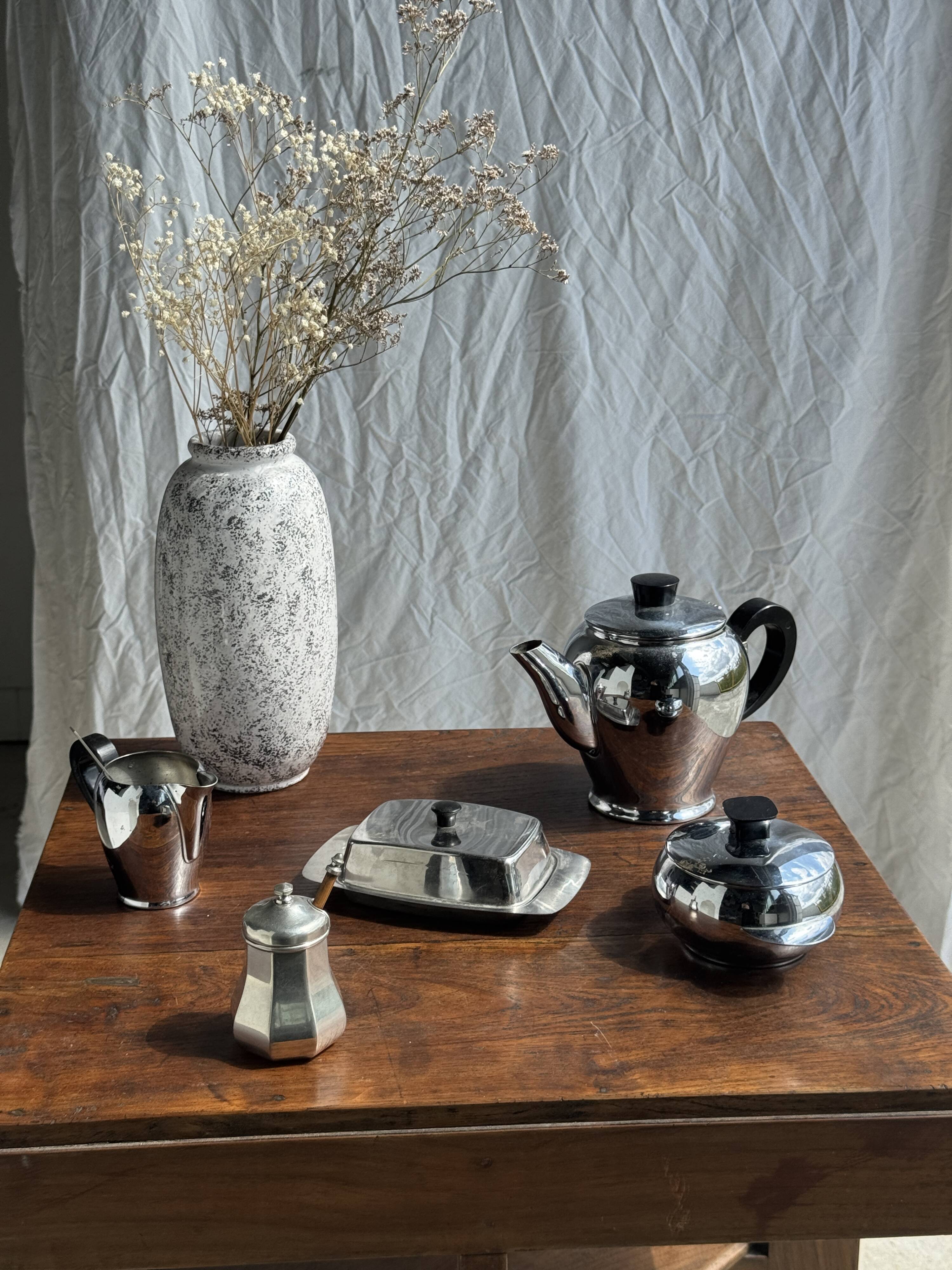 Tea set including teapot, milk jug, sugar bowl and butter dish
