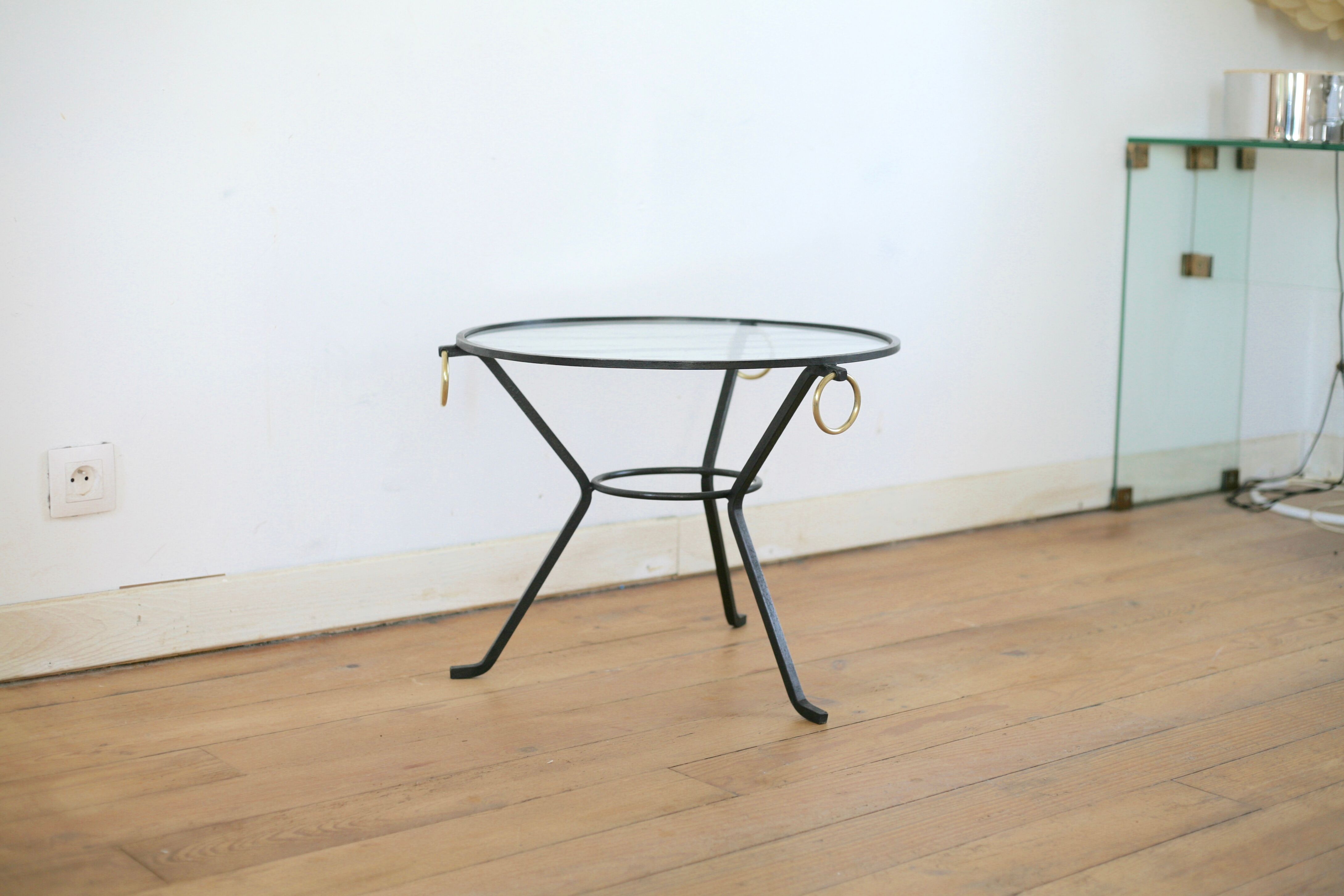 Coffee table black lacquered metal, glass and brass, France, circa 1950.