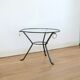Coffee table black lacquered metal, glass and brass, France, circa 1950.