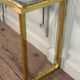 Golden and chrome metal console, bevelled glass, circa 1980.