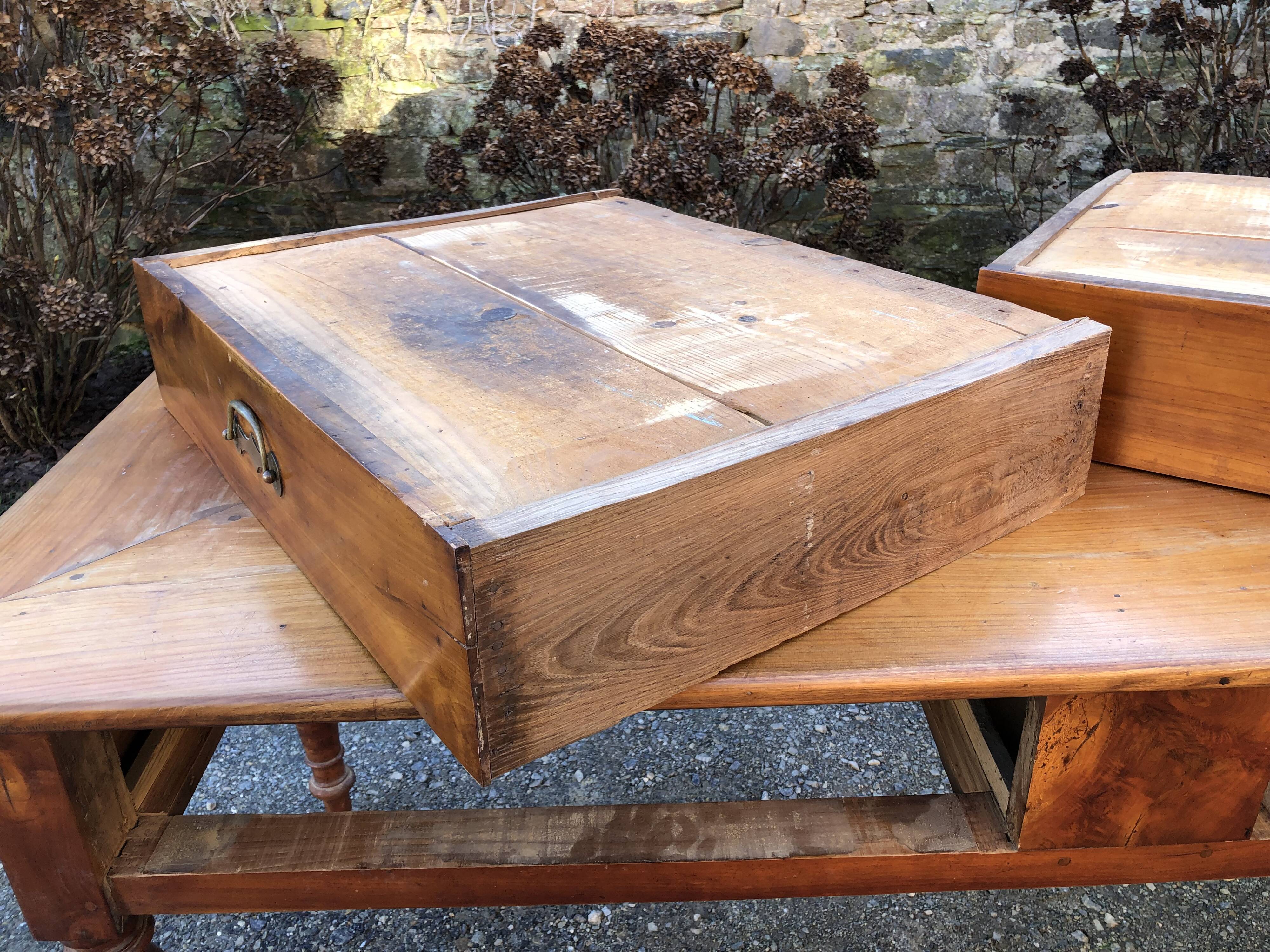 Antique cherry farmhouse table with turned legs and 2 drawers.