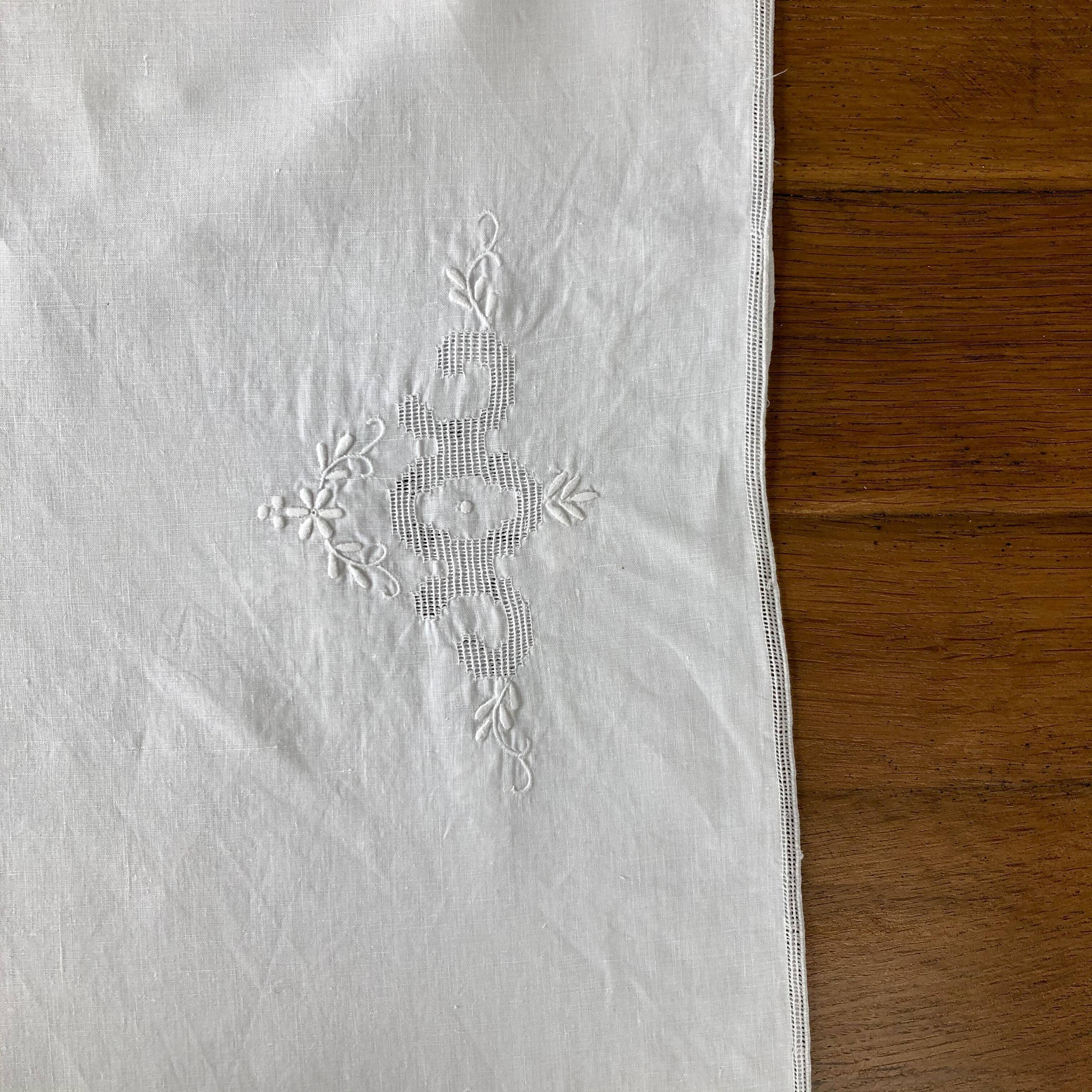 White coat embroidered floral patterns