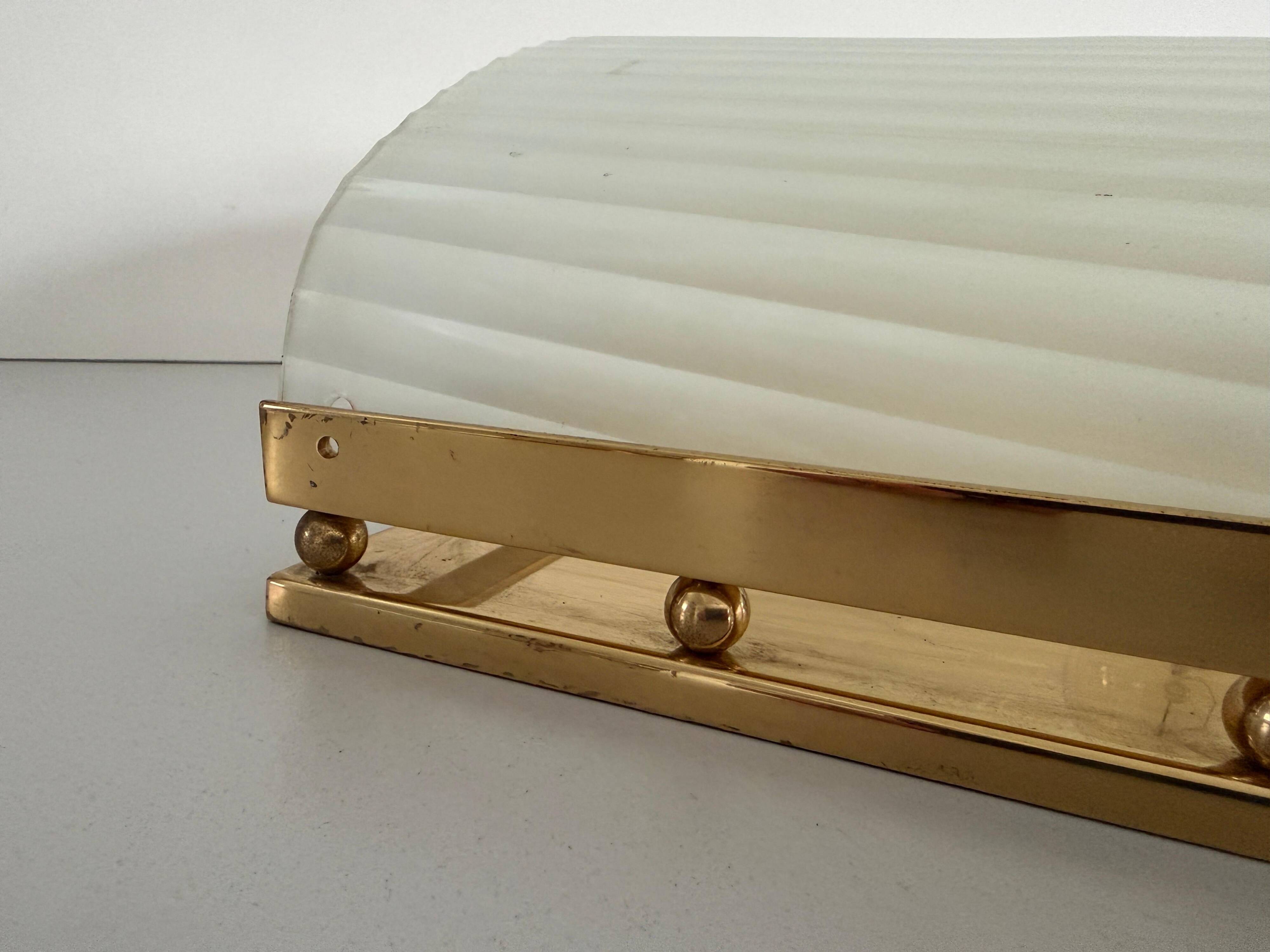 Large heavy glass wall light with a brass frame from the mid-century, 1950s, Italy.