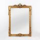 Highly decorated gilted carved wooden wall mirror, Belgium ca. 1950