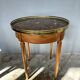 Hot water bottle table with a marble top and a brass gallery.