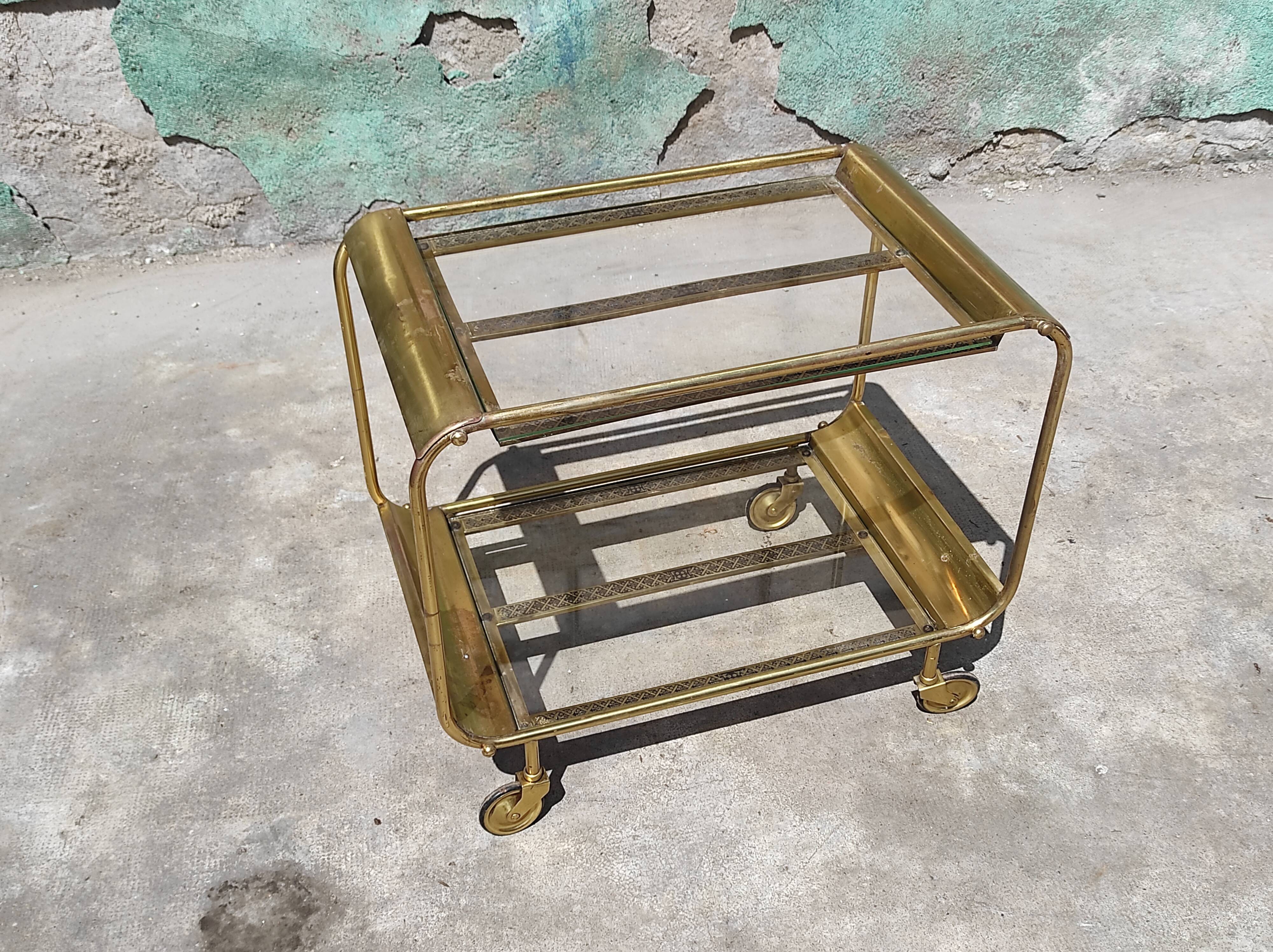 Old rolling coffee table serving vintage brass bar 50s mid-century design