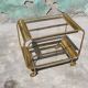 Old rolling coffee table serving vintage brass bar 50s mid-century design