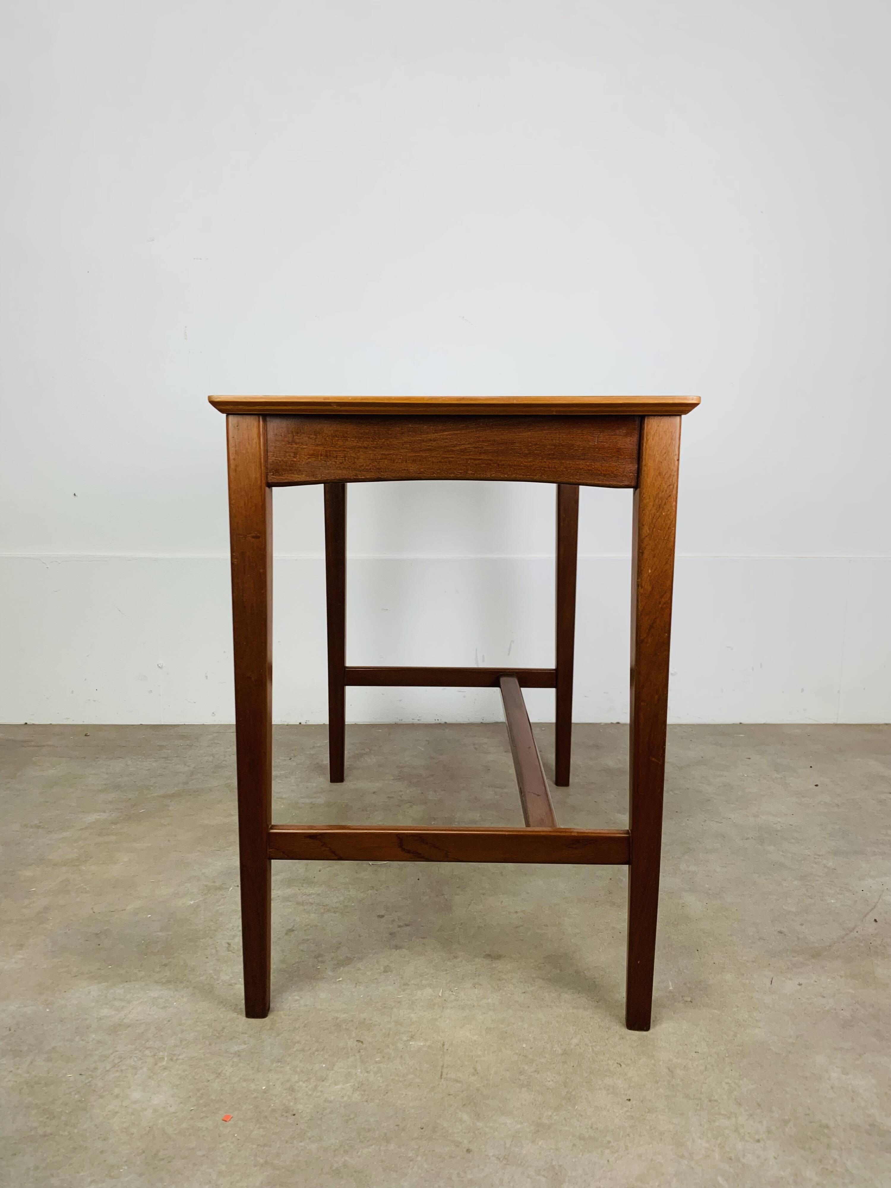 Minimalist Scandinavian teak desk from the 1960s, vintage.