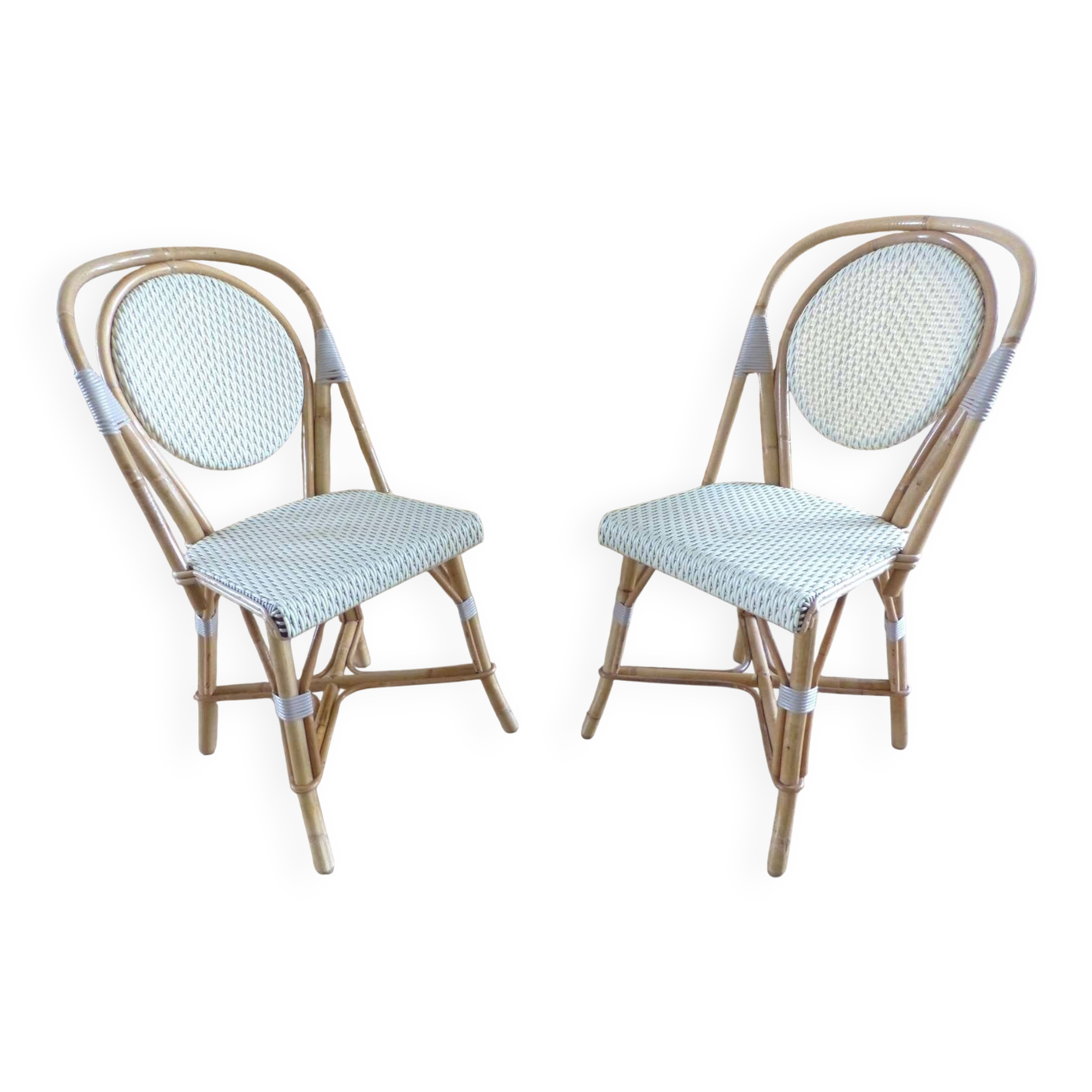 Pair of Parisian bistro chairs from Maison Louis Drucker in light Manila rattan.