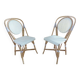 Pair of Parisian bistro chairs from Maison Louis Drucker in light Manila rattan.