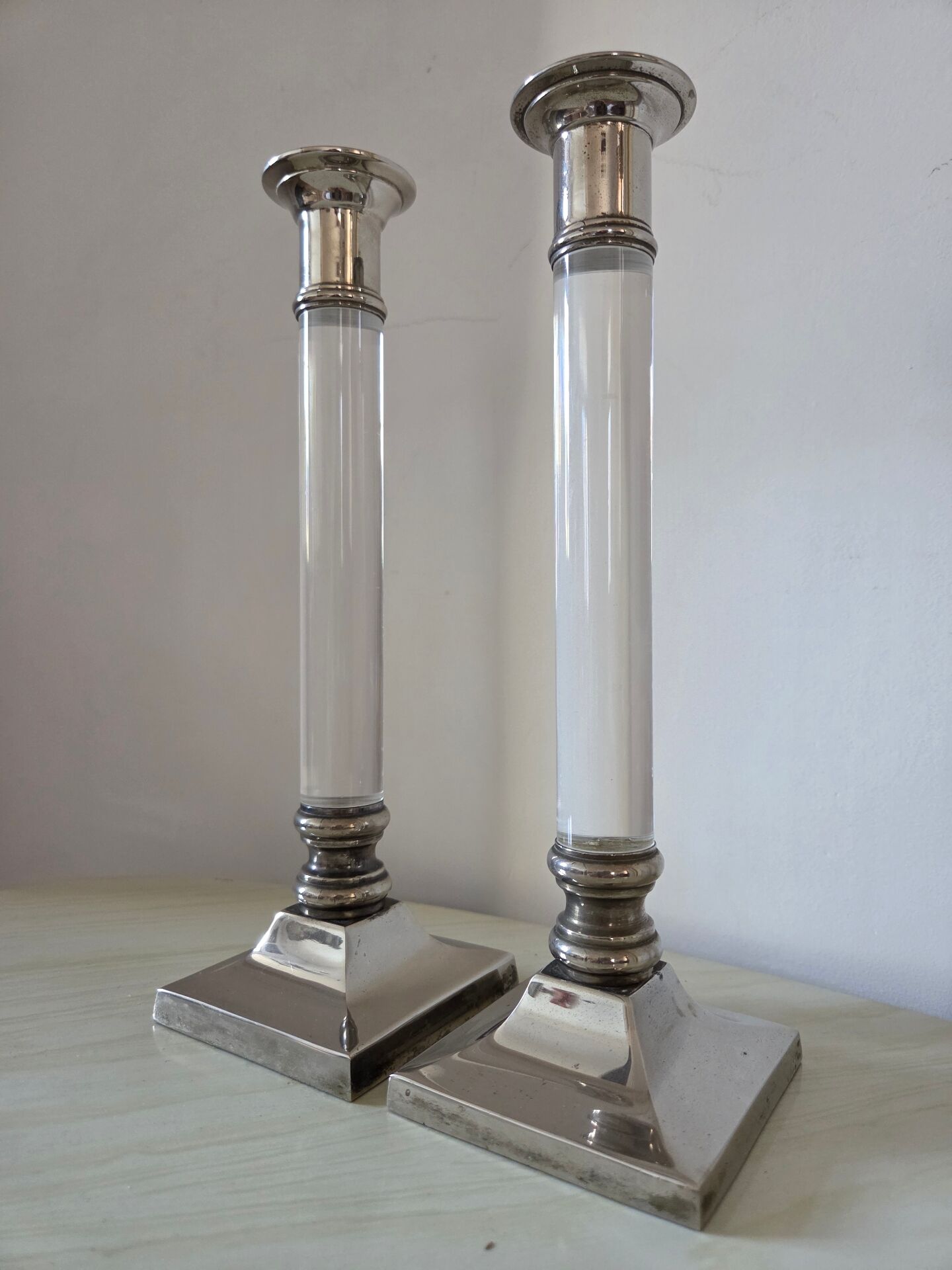 Pair of lucite and silver-plated candlesticks