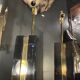 Pair of black lacquered and brass table lamps, circa 1970