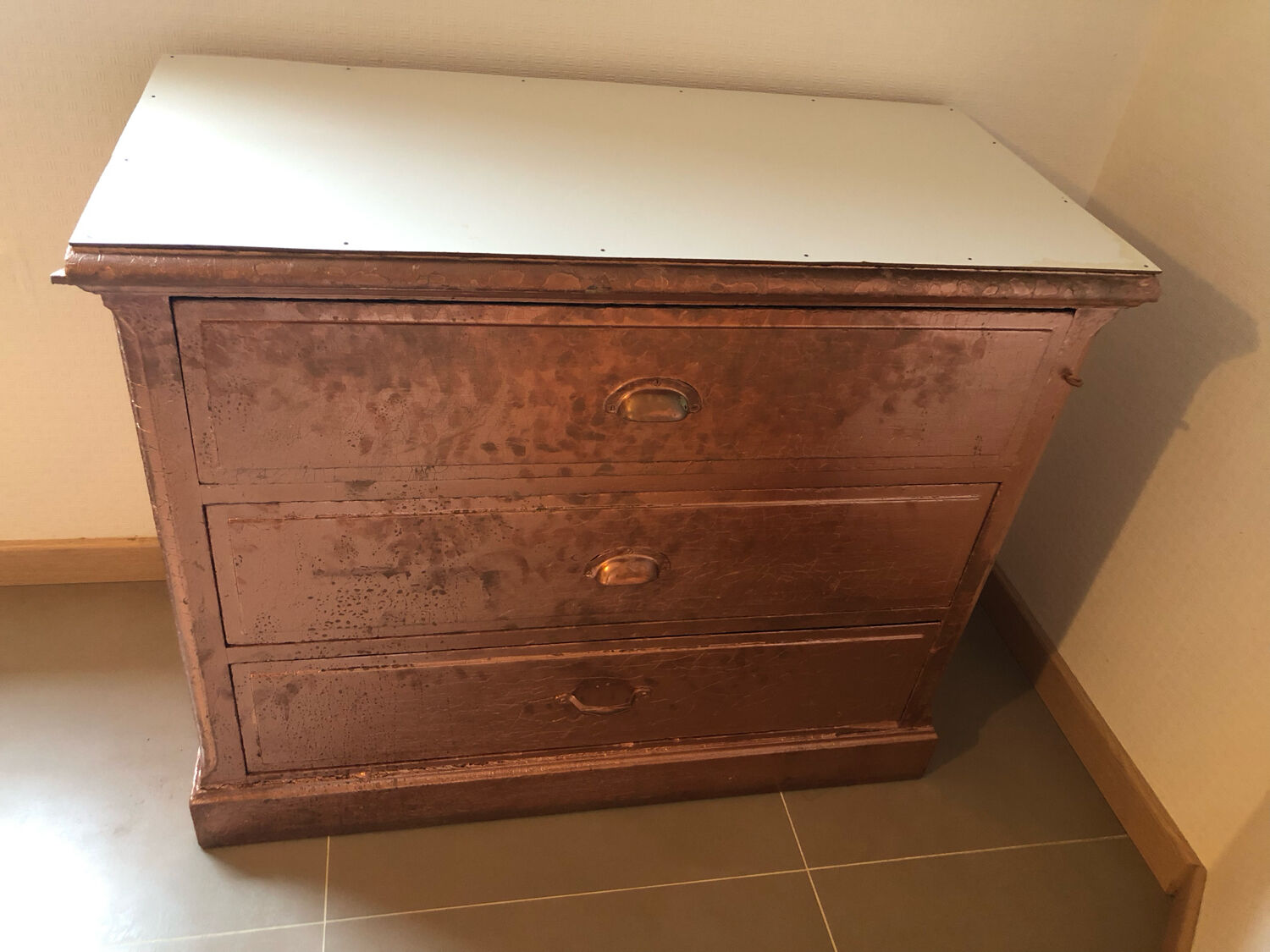 Old chest of drawers restored golden copper color