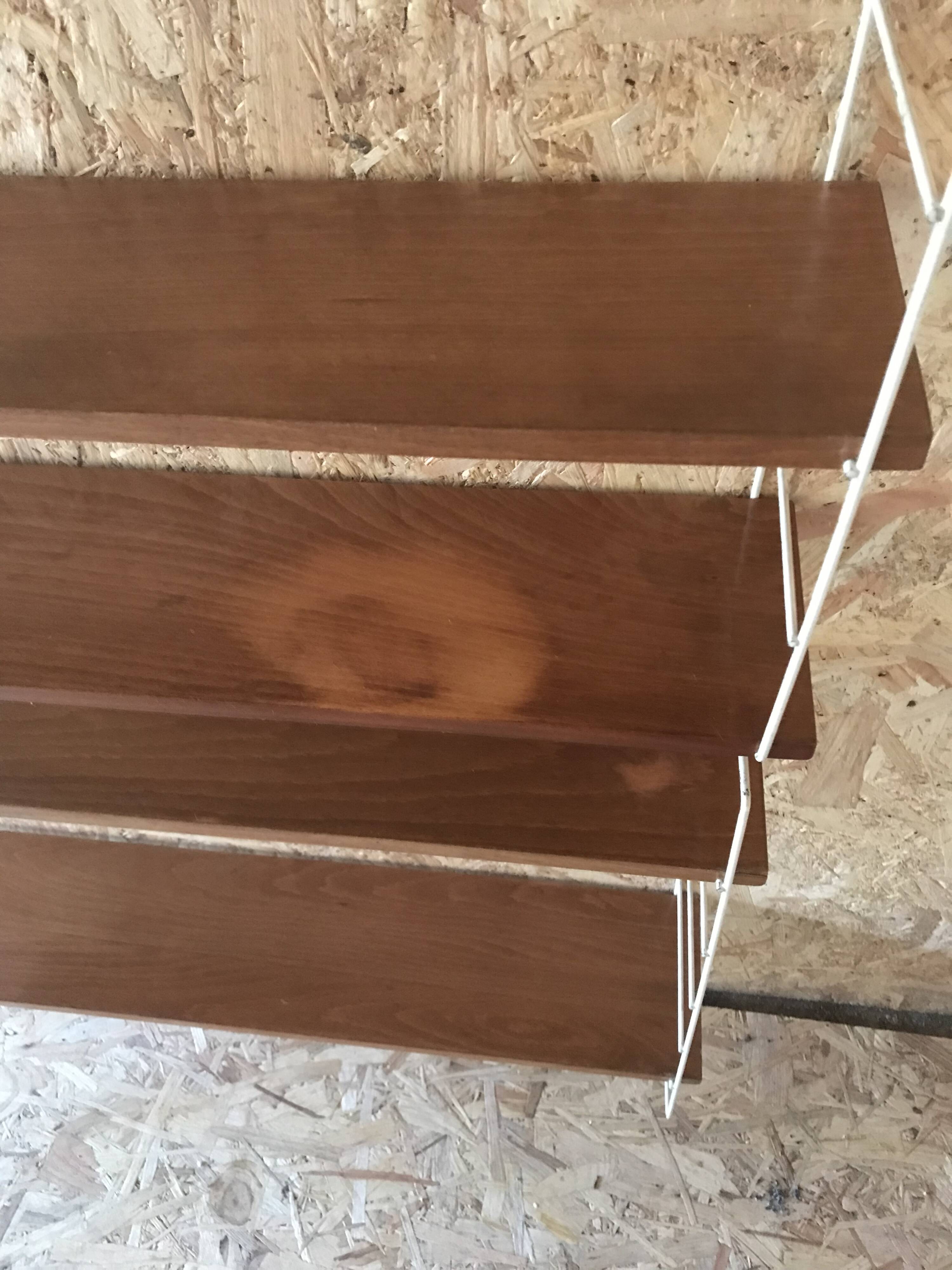 Vintage modular wall shelf with 4 supports and 5 levels.