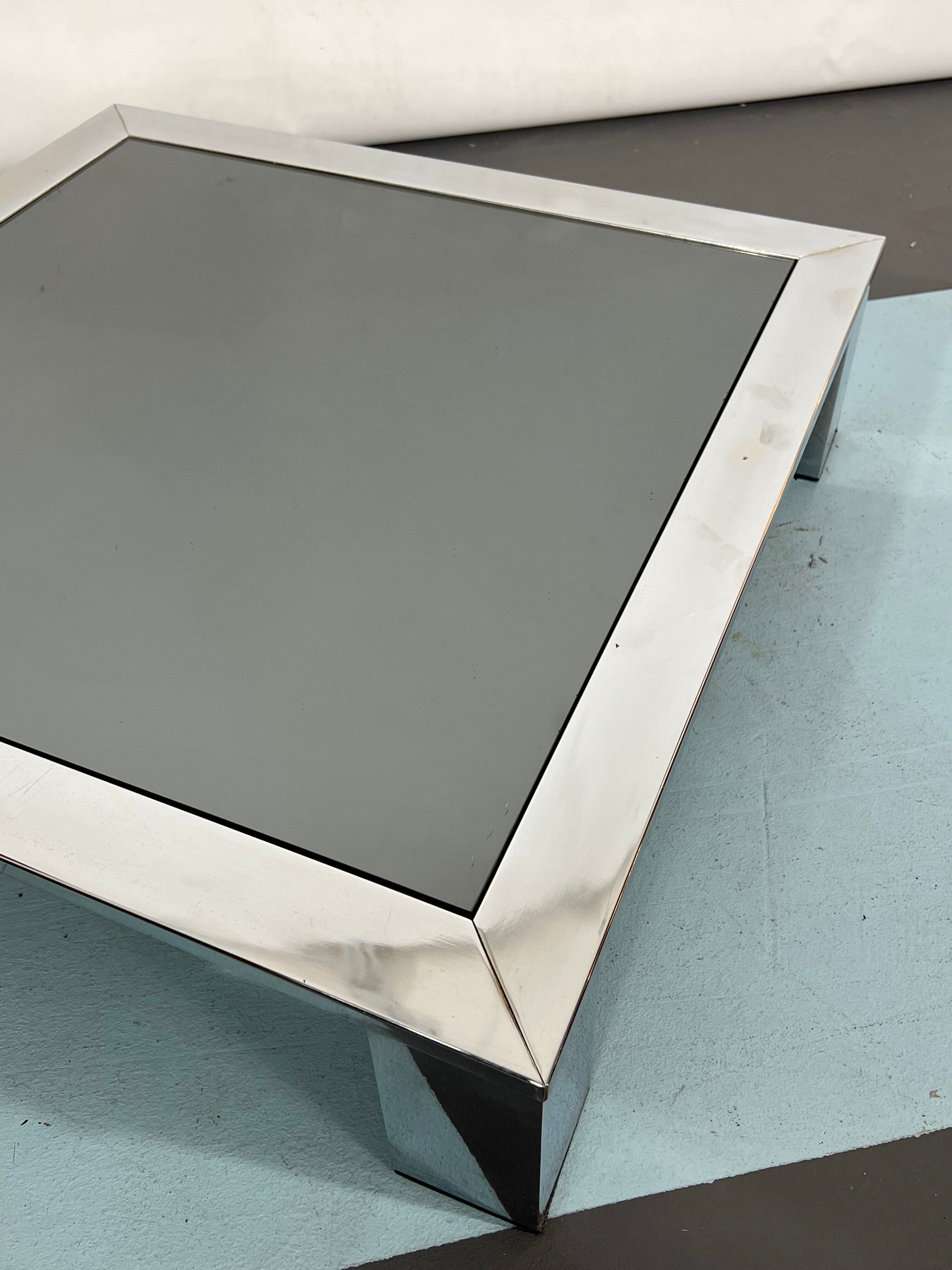 Mid-century chrome and dark mirror glass side table attributed to Saporiti. Italy 1970s