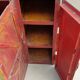 Old atypical metal workshop furniture with its original red patina