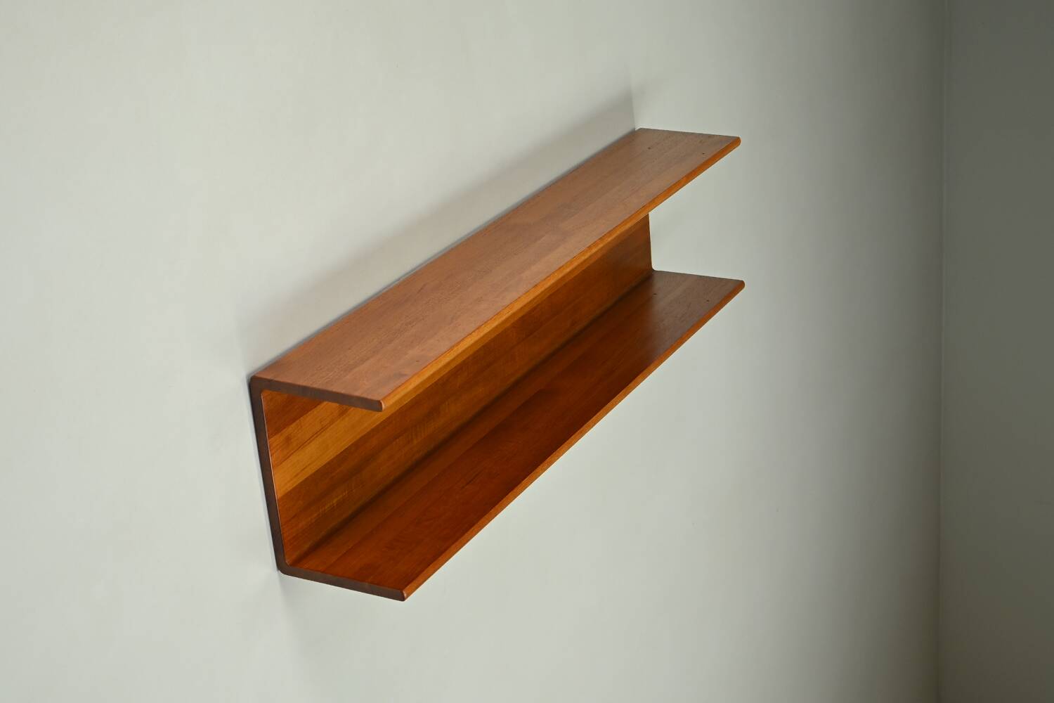 Solid teak wall shelf, 1960s Germany.