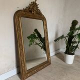 Golden fireplace mirror with pediment