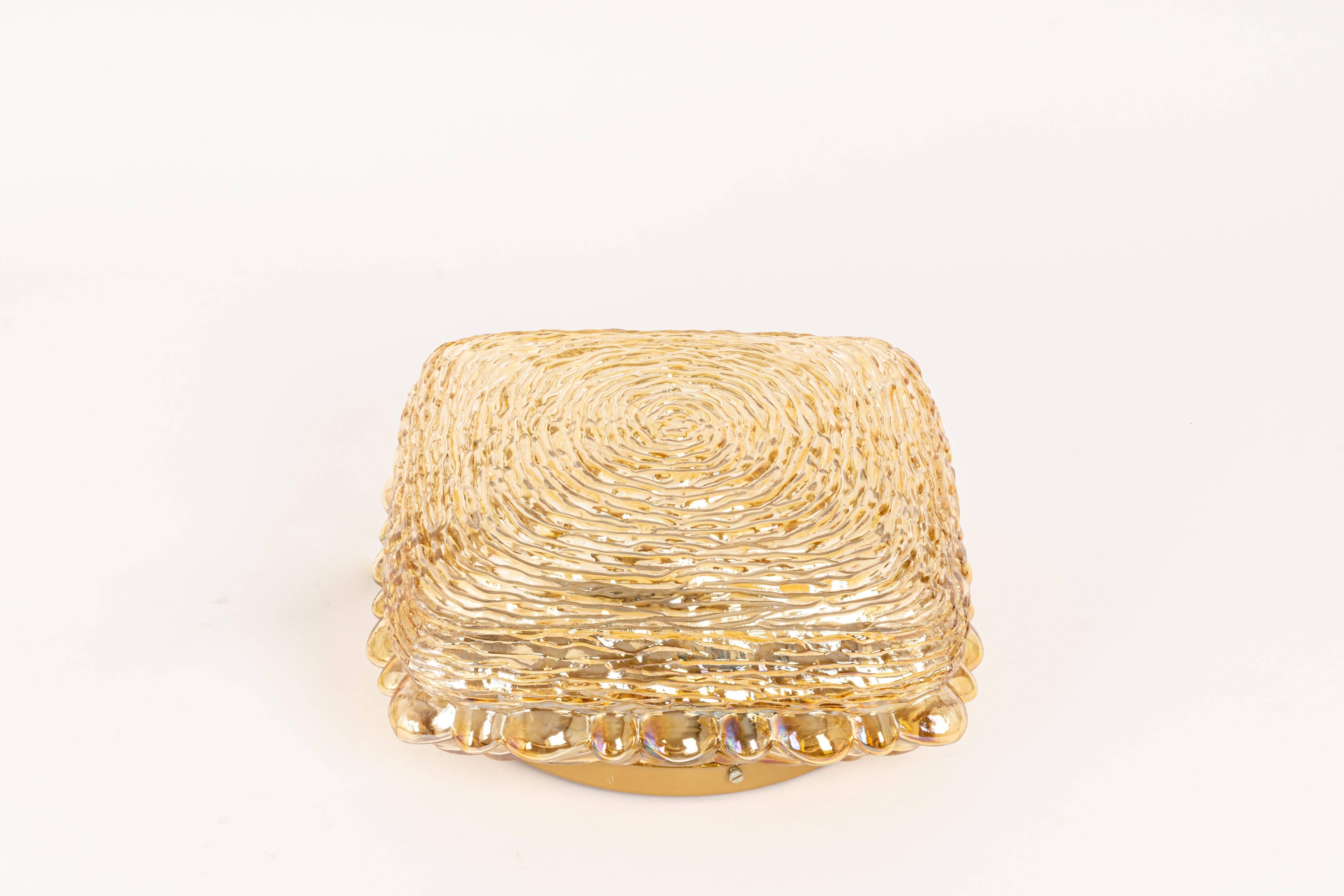 Amber glass wall light in the shape of a fingerprint, Germany, 1970s.