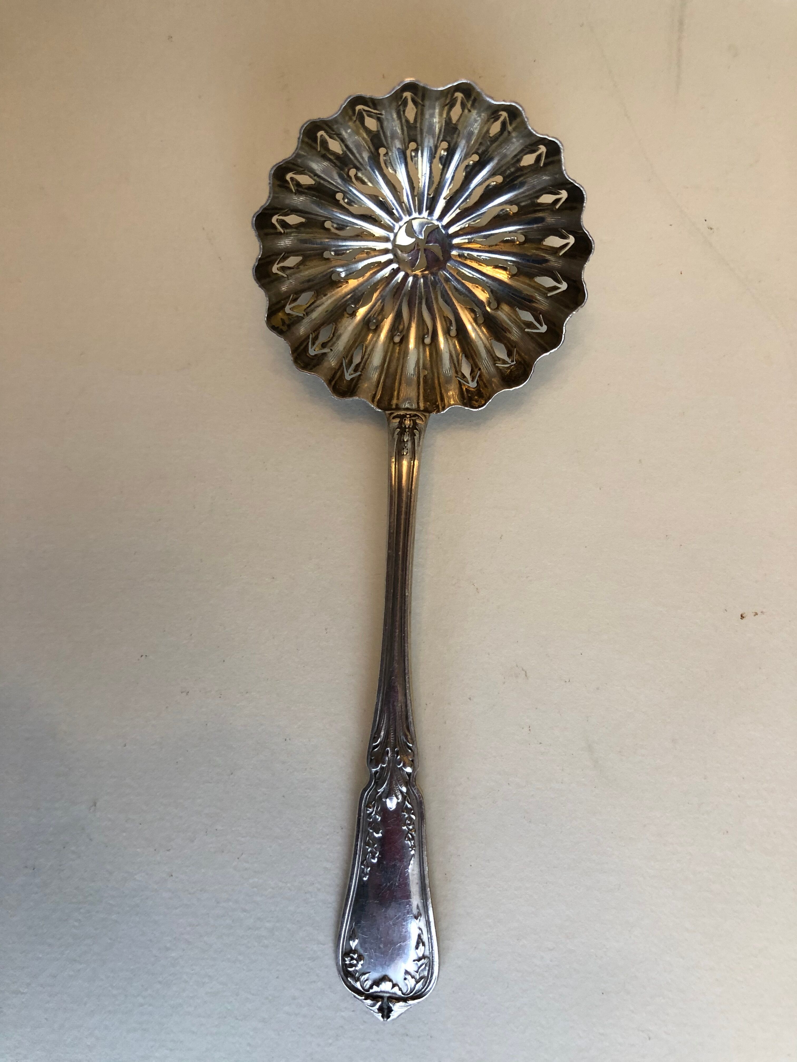 Silver sprinkler spoon